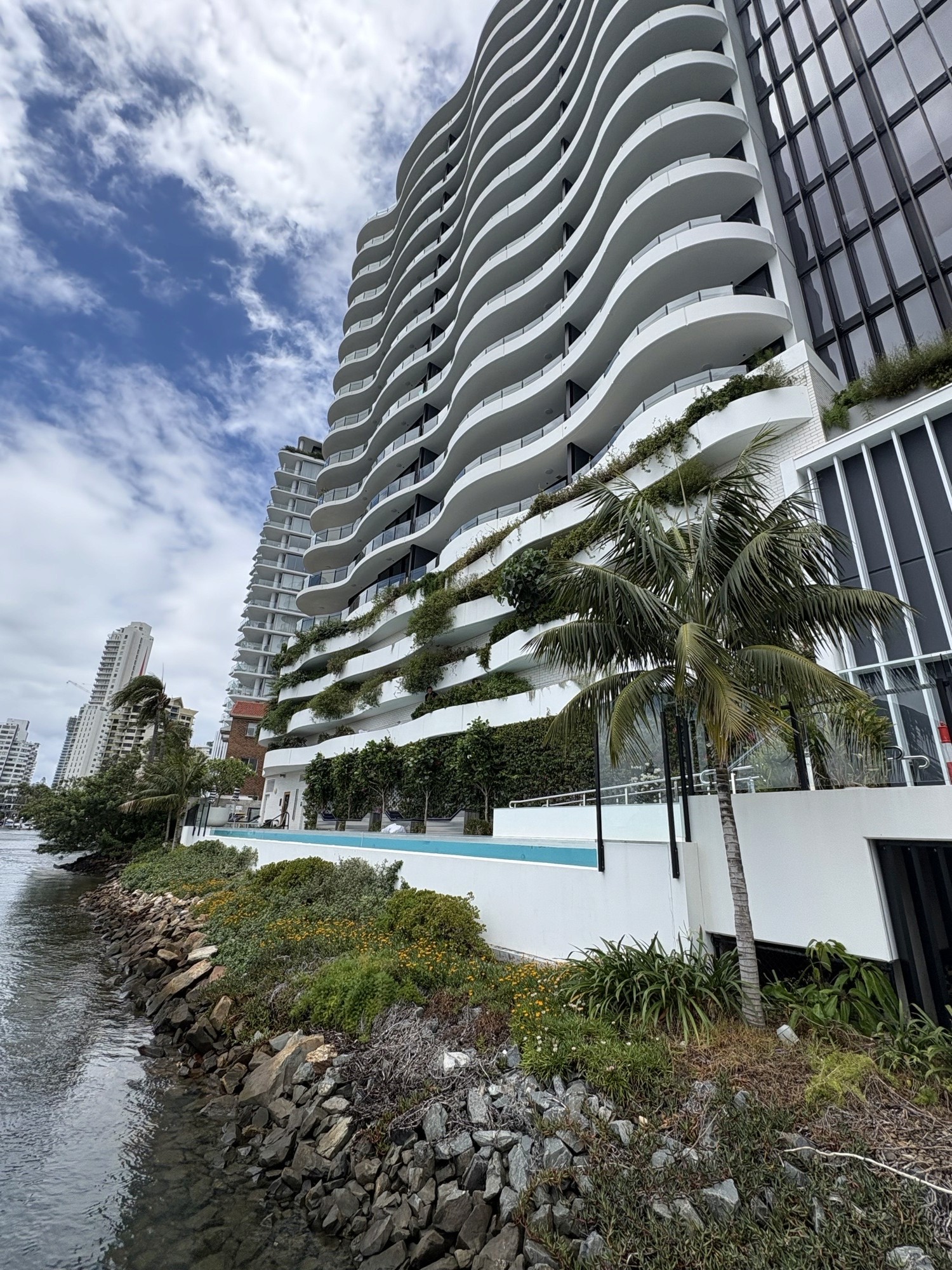 High access commercial garden maintenance on elevated tiered garden beds at a Surfers Paradise high-rise building Gold Coast