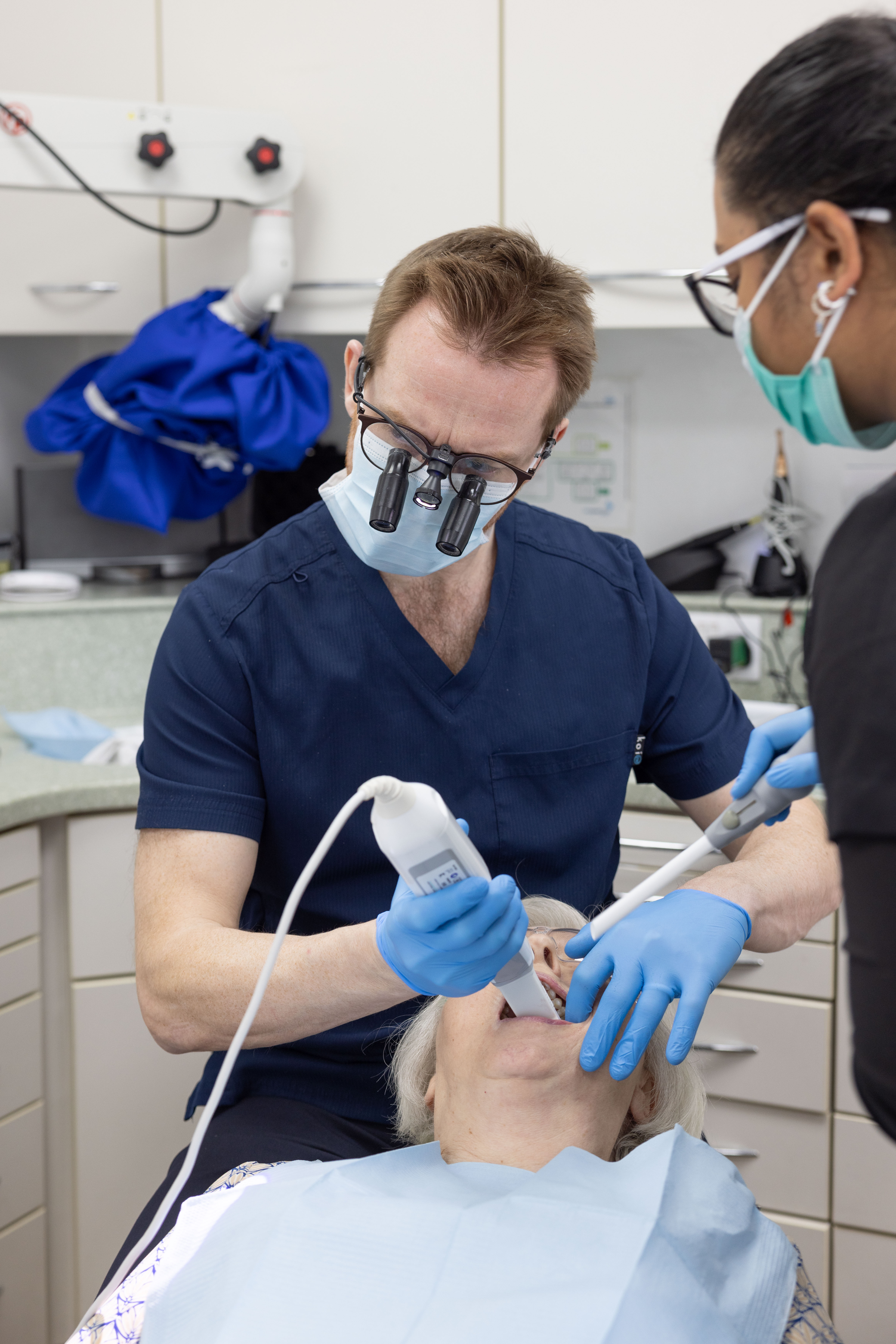 a dentist working on a patient
