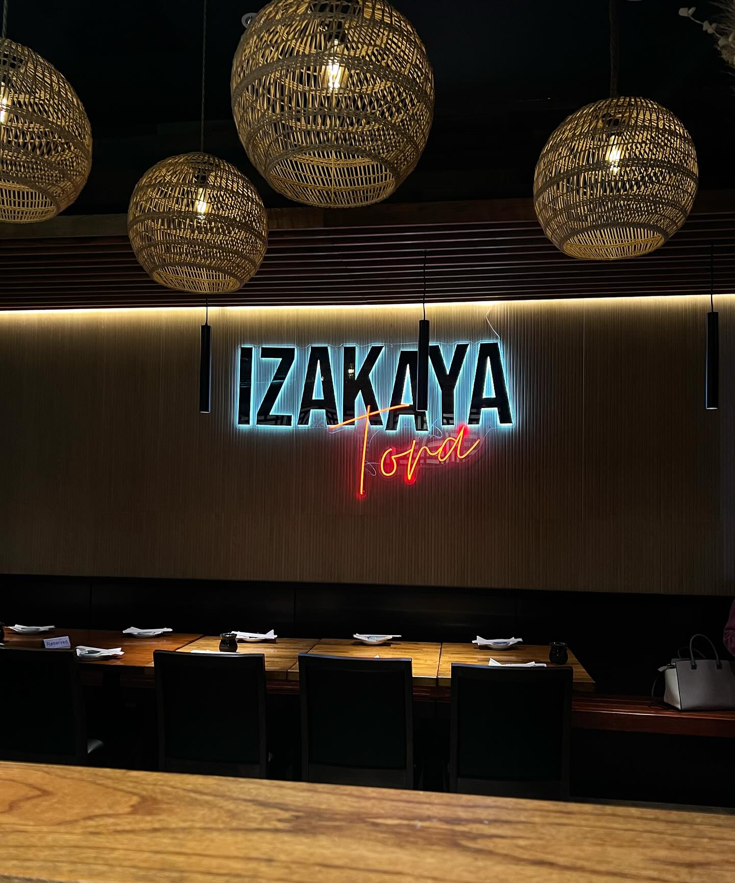 Izakaya Tora’s modern interior in West Hollywood, blending warm wood accents with a sleek, minimalist design for a cozy yet refined dining atmosphere.