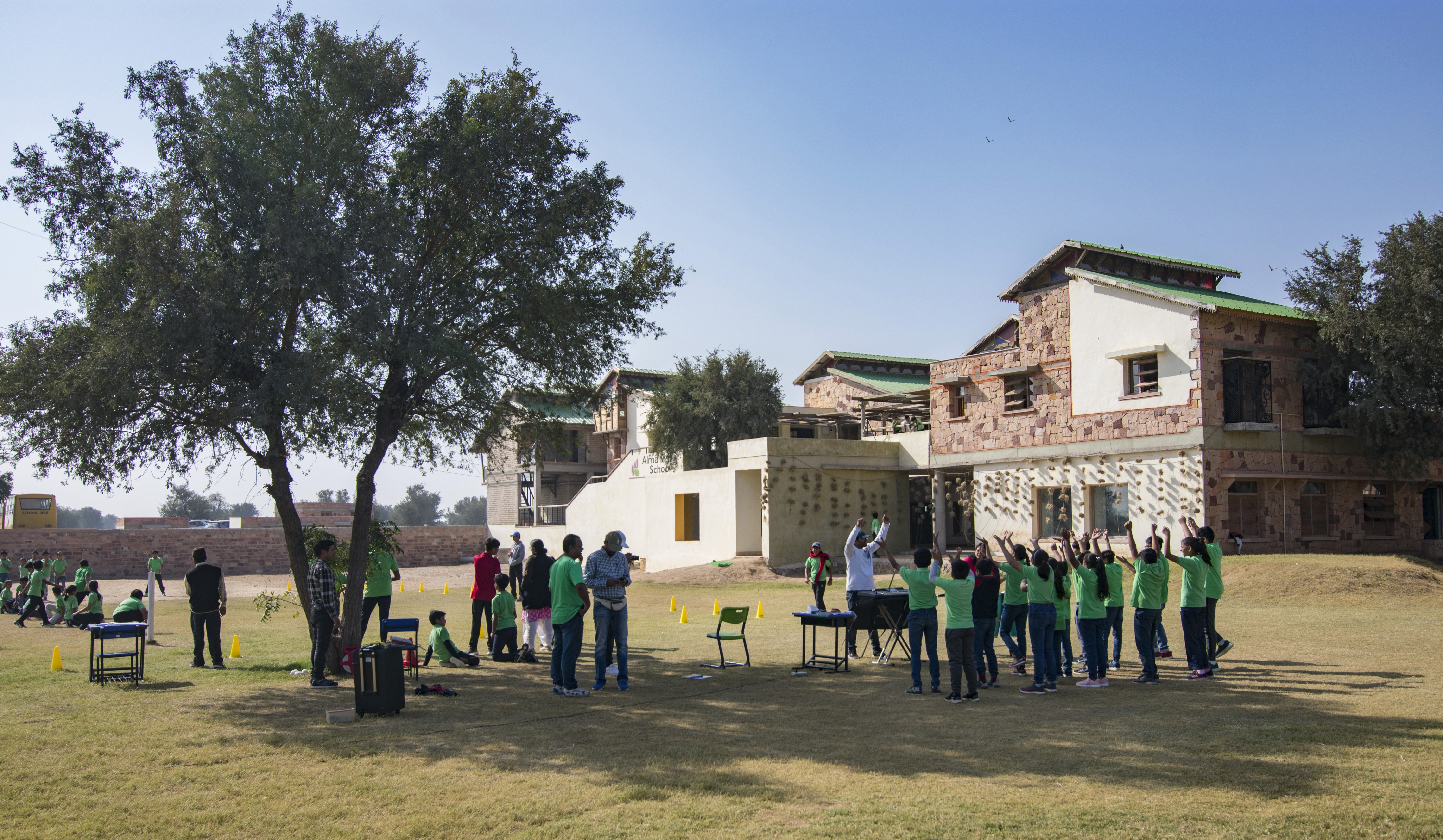 A school campus with buildings, open walkways, and greenery