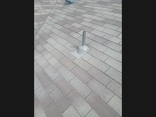 Repaired pipe boot and surrounding shingles in Converse, Texas.