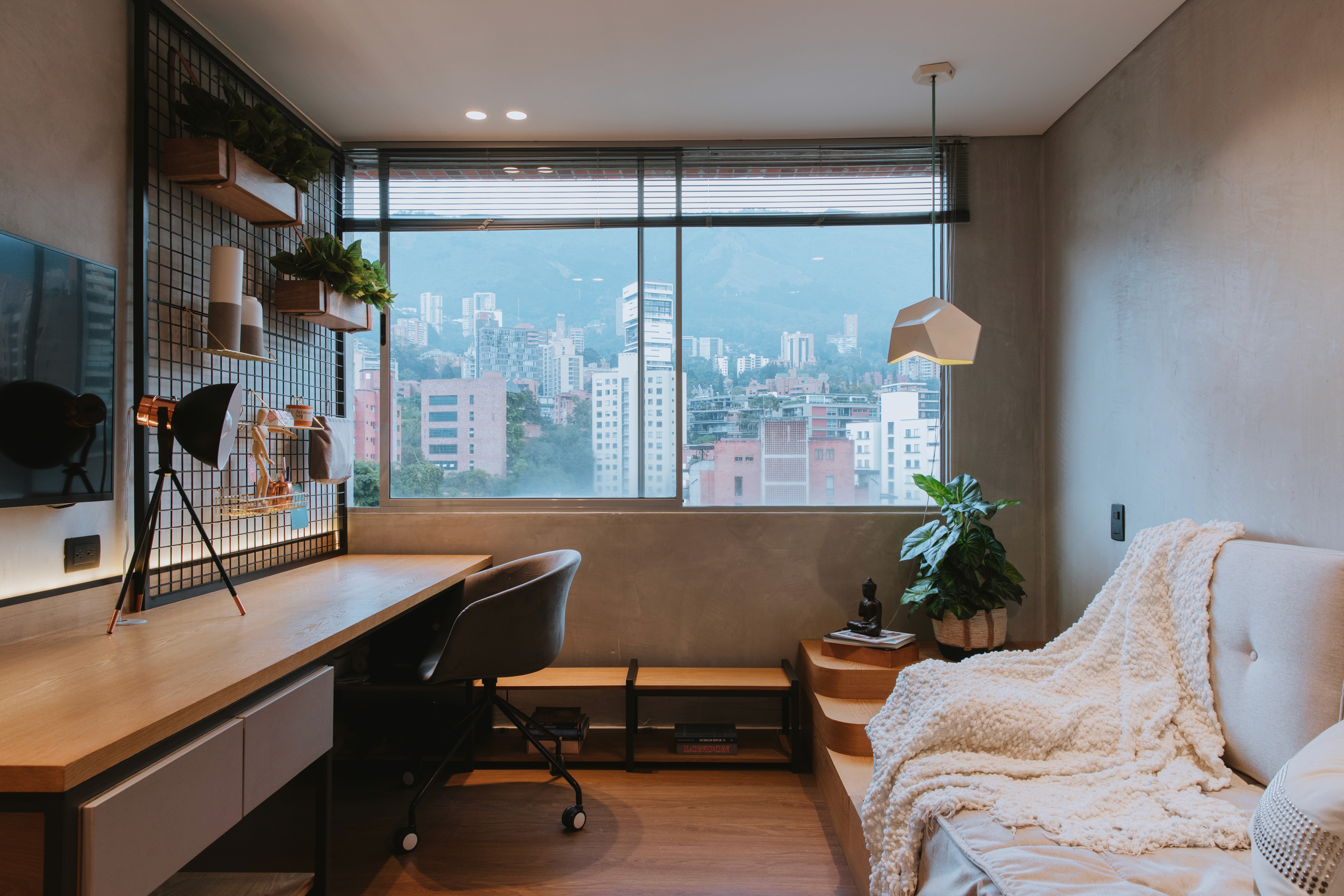 Double-height interior with flowing sculptural forms and warm raking light