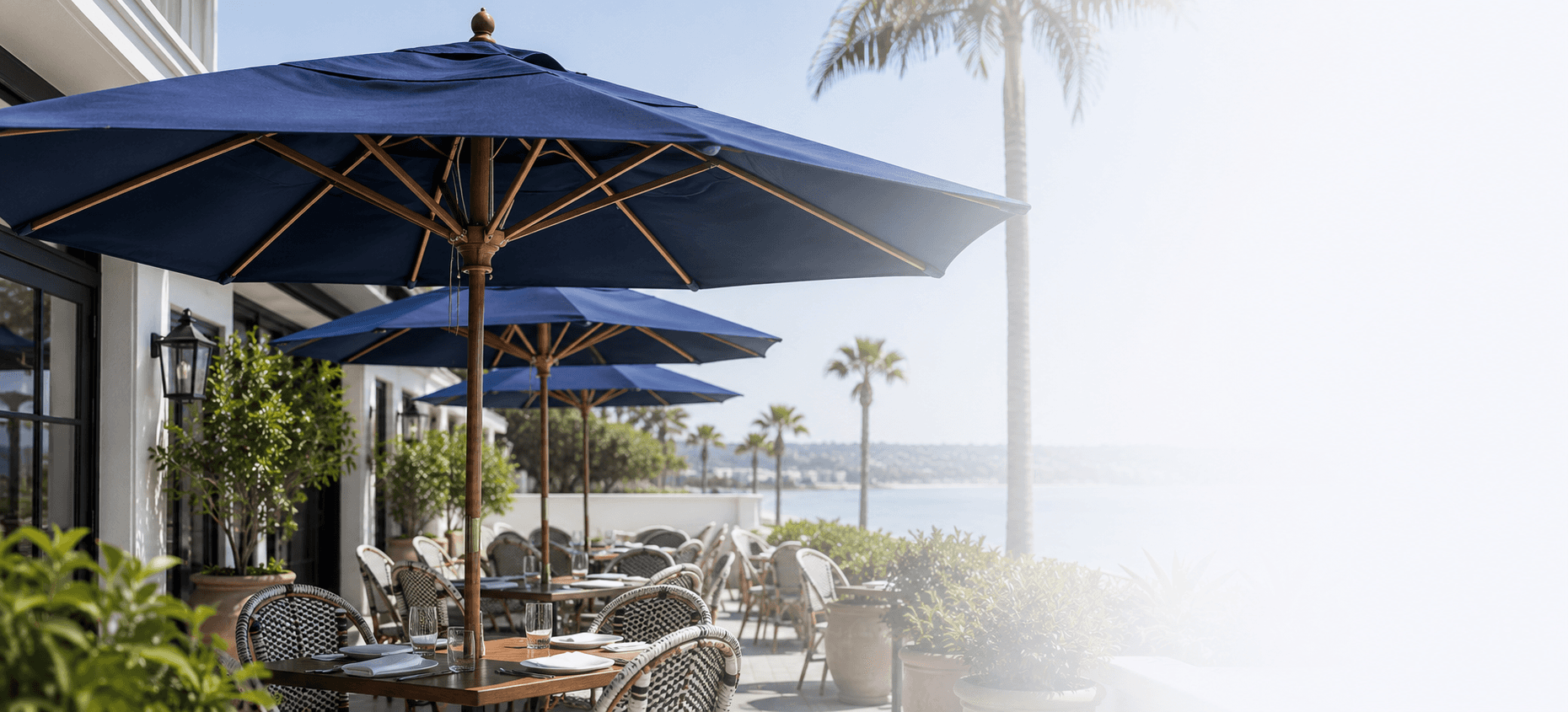 Outdoor umbrellas and patio seating at a luxury home in San Diego.