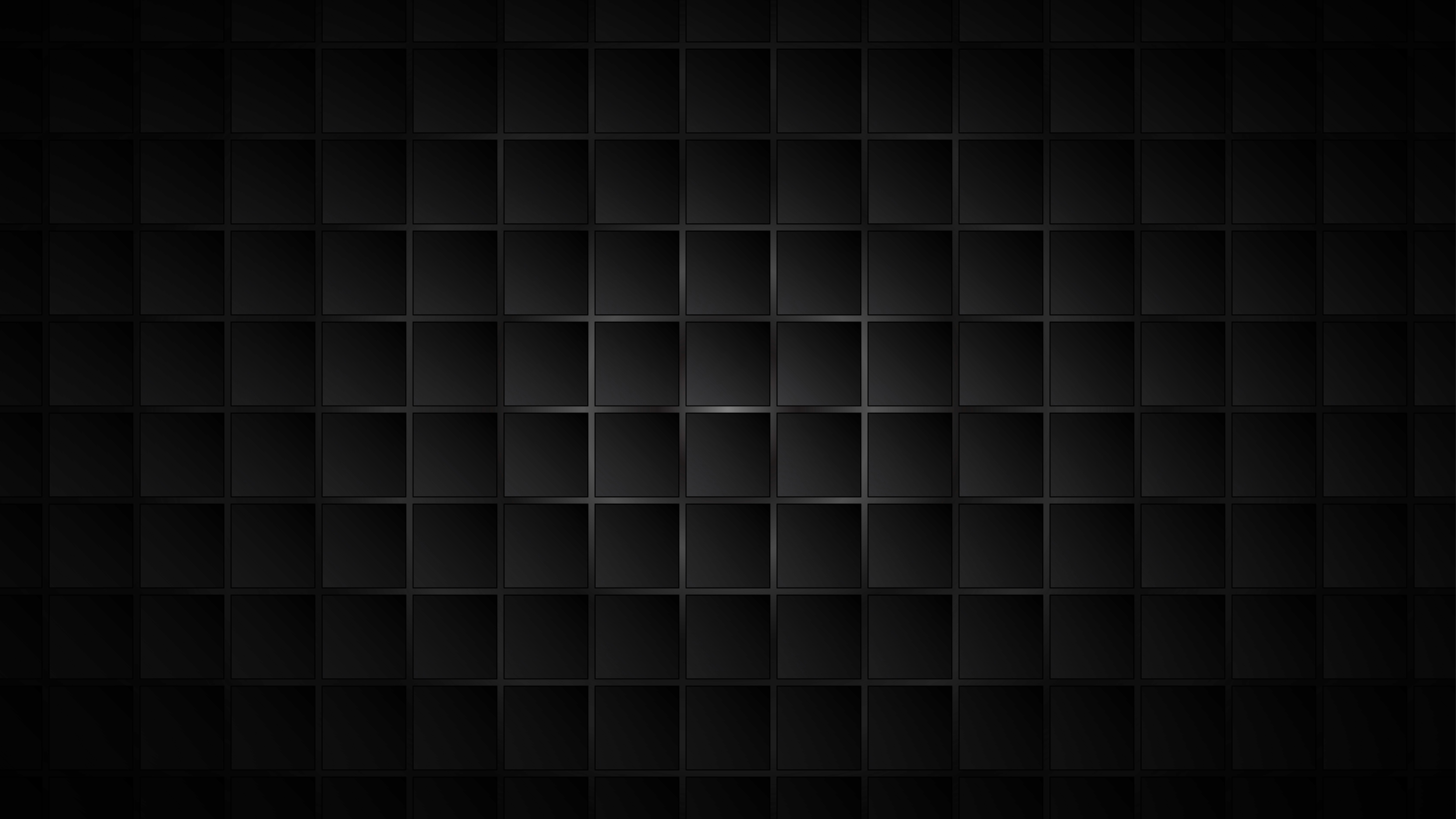 Black cosmetic product bottle against a dark background