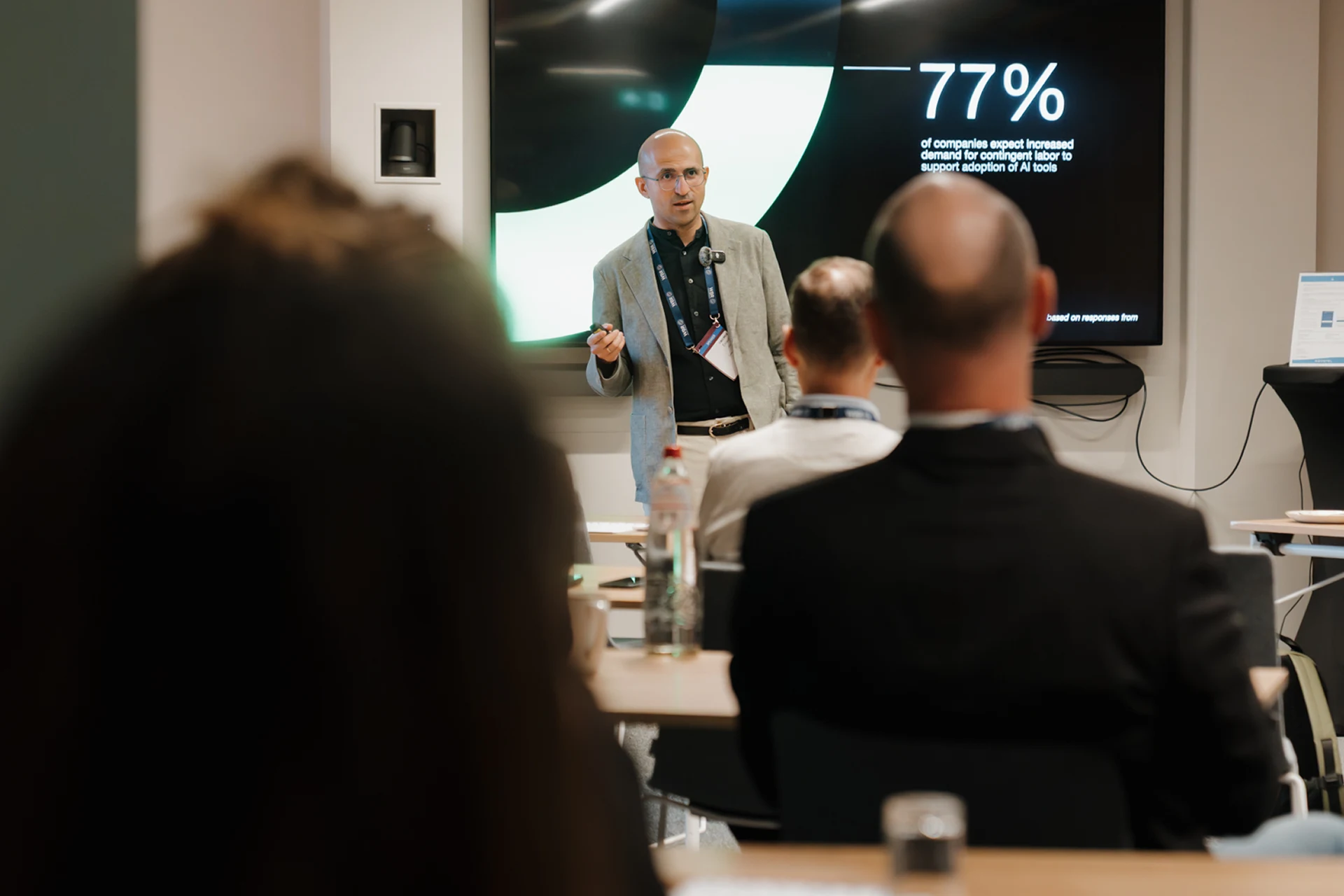 Ernesto presenting about IC and Employee's in front of audience