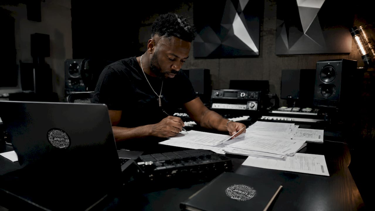 Music producer reviewing licensing documents
