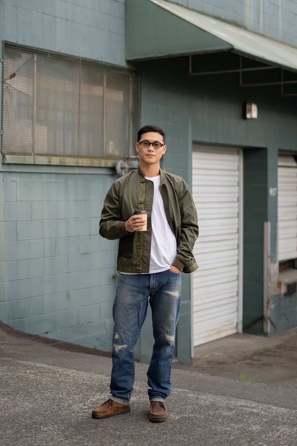 Black and white photo of man posing on camera