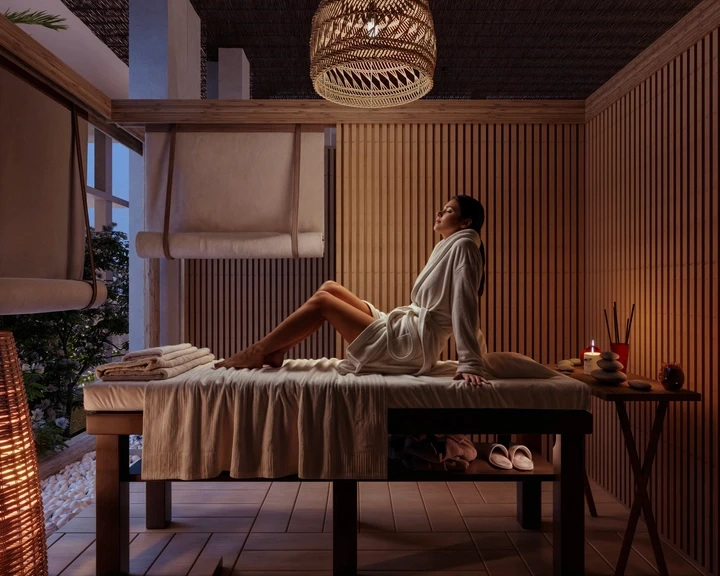 An aerial view of a pool surrounded by trees