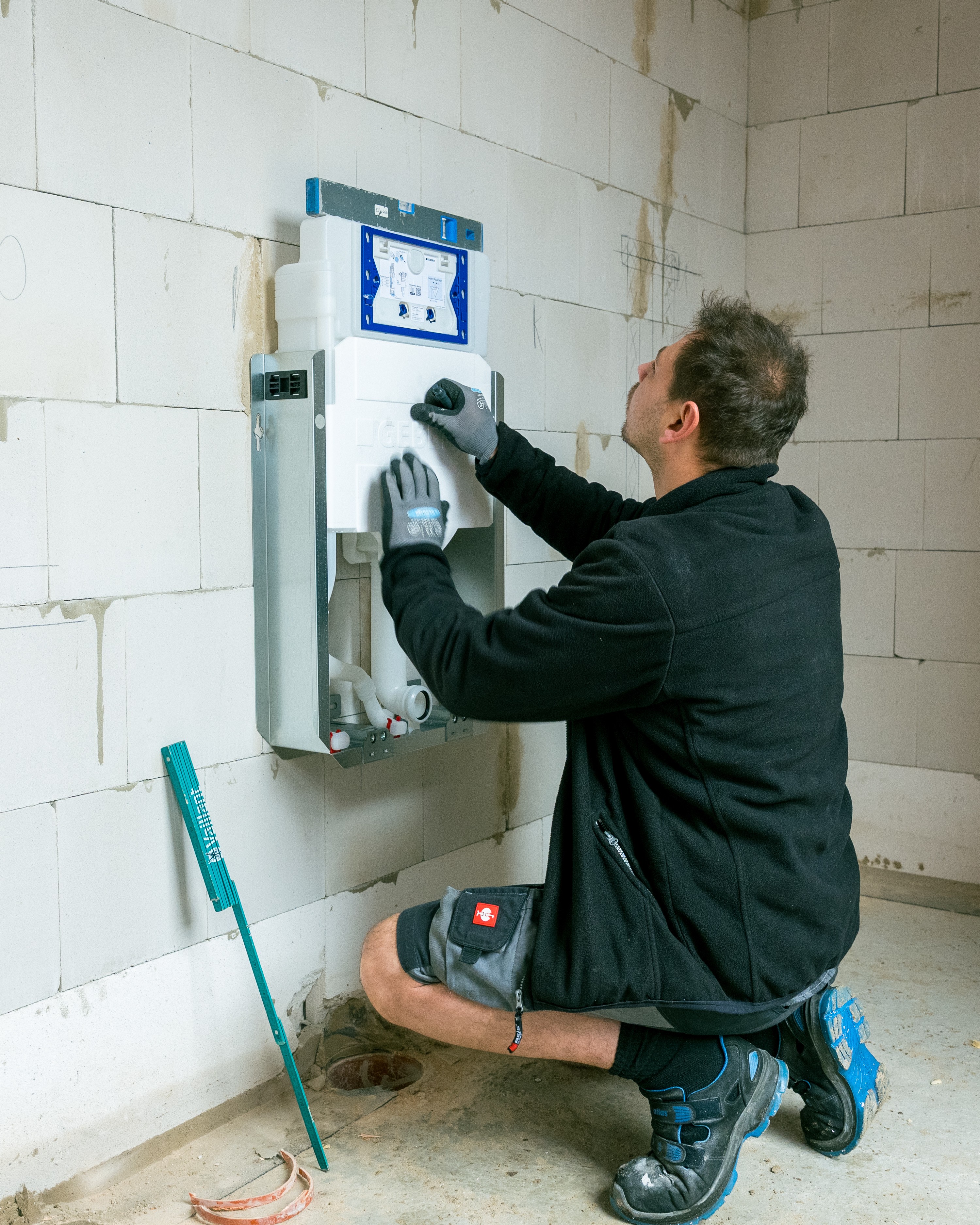 Four friends climbing over a wooden fence outdoors