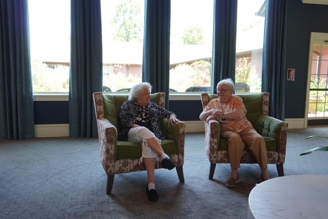 Residents talking in Rock Creek manor Lobby