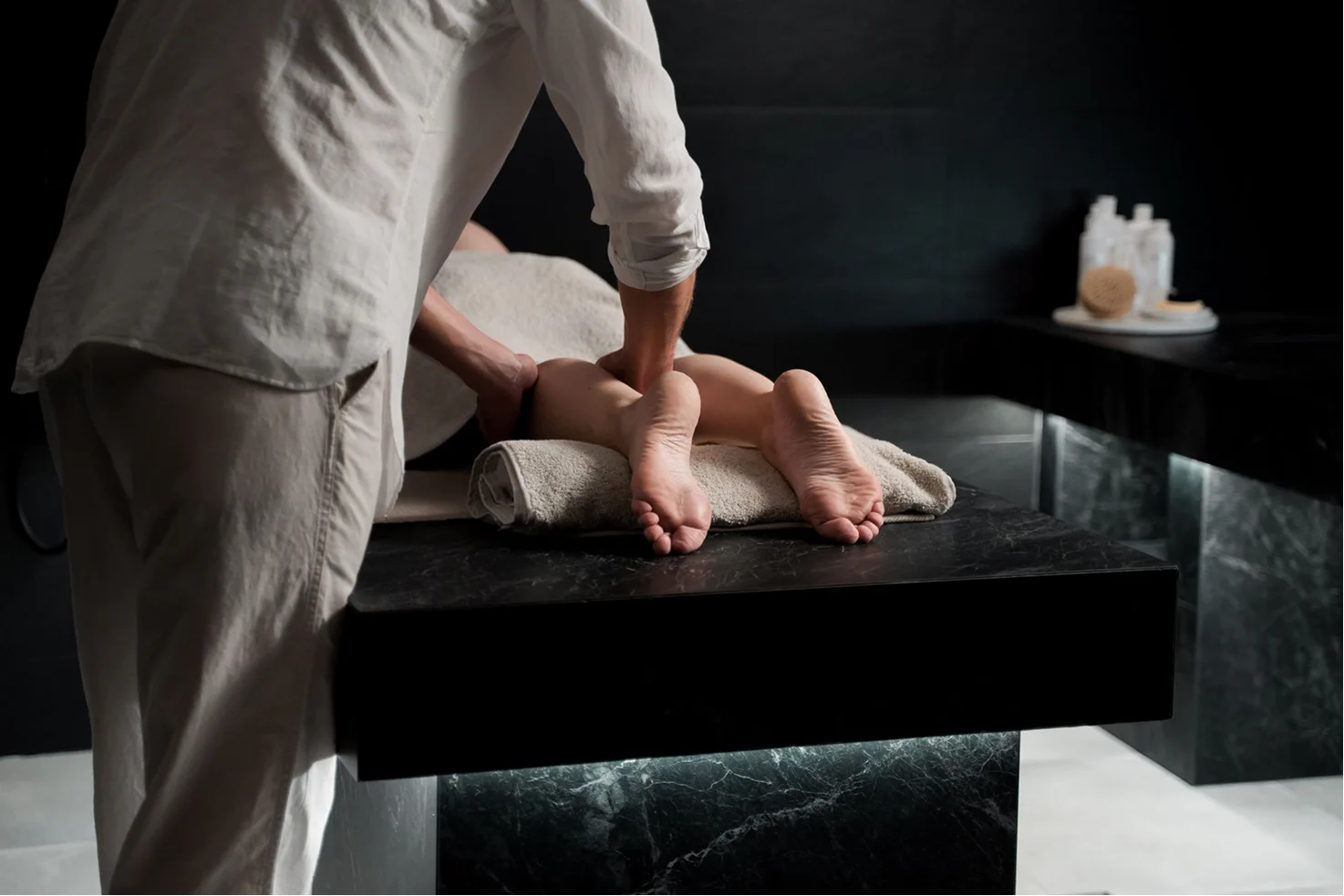 Guest receiving a relaxing foot massage during a spa treatment.