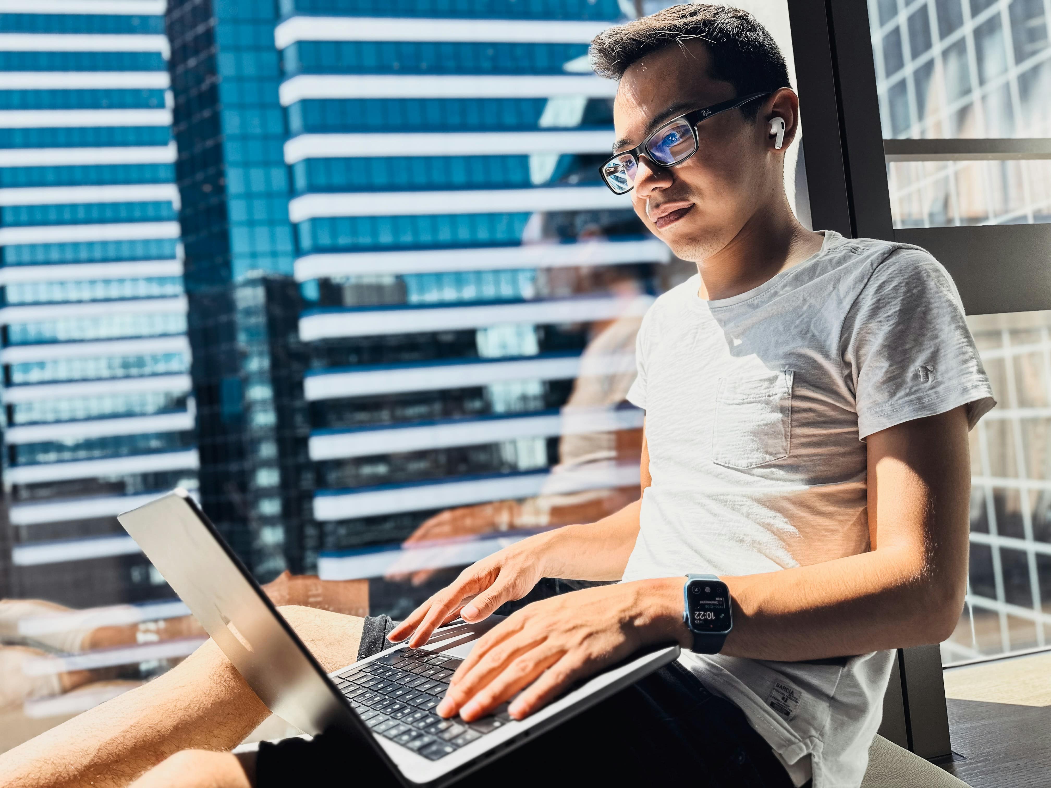 man sitting by the window - Summarize Research Paper ChatGPT 