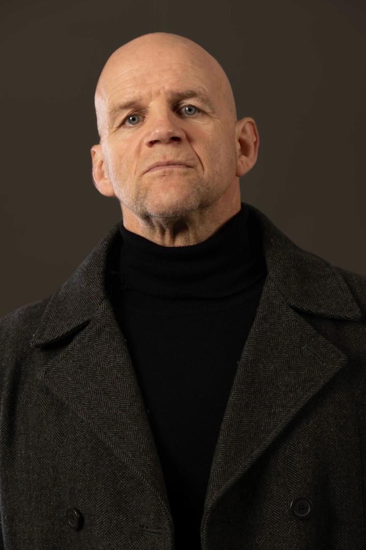 A man having his portrait taken. 