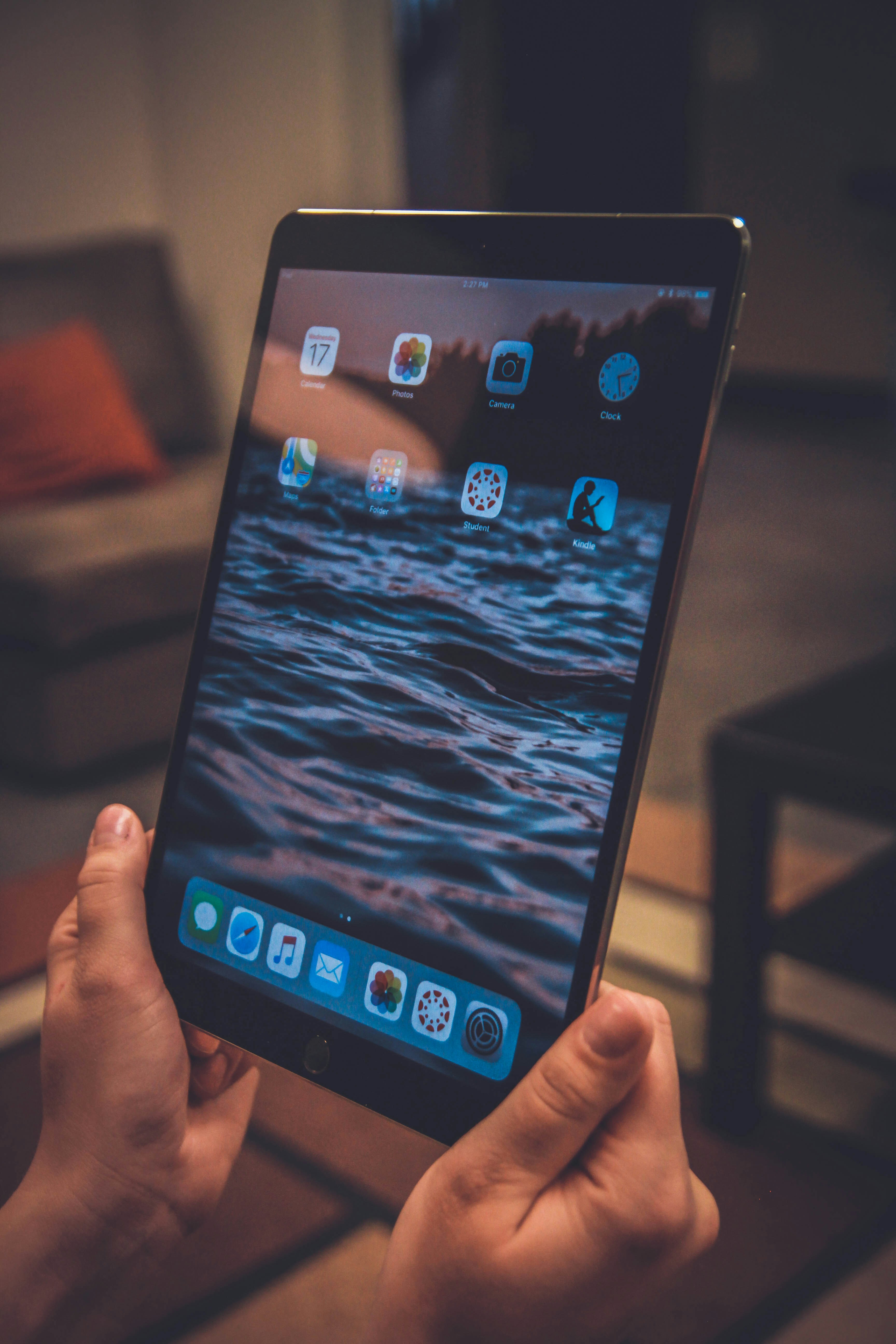 man holidng ipad using engagement