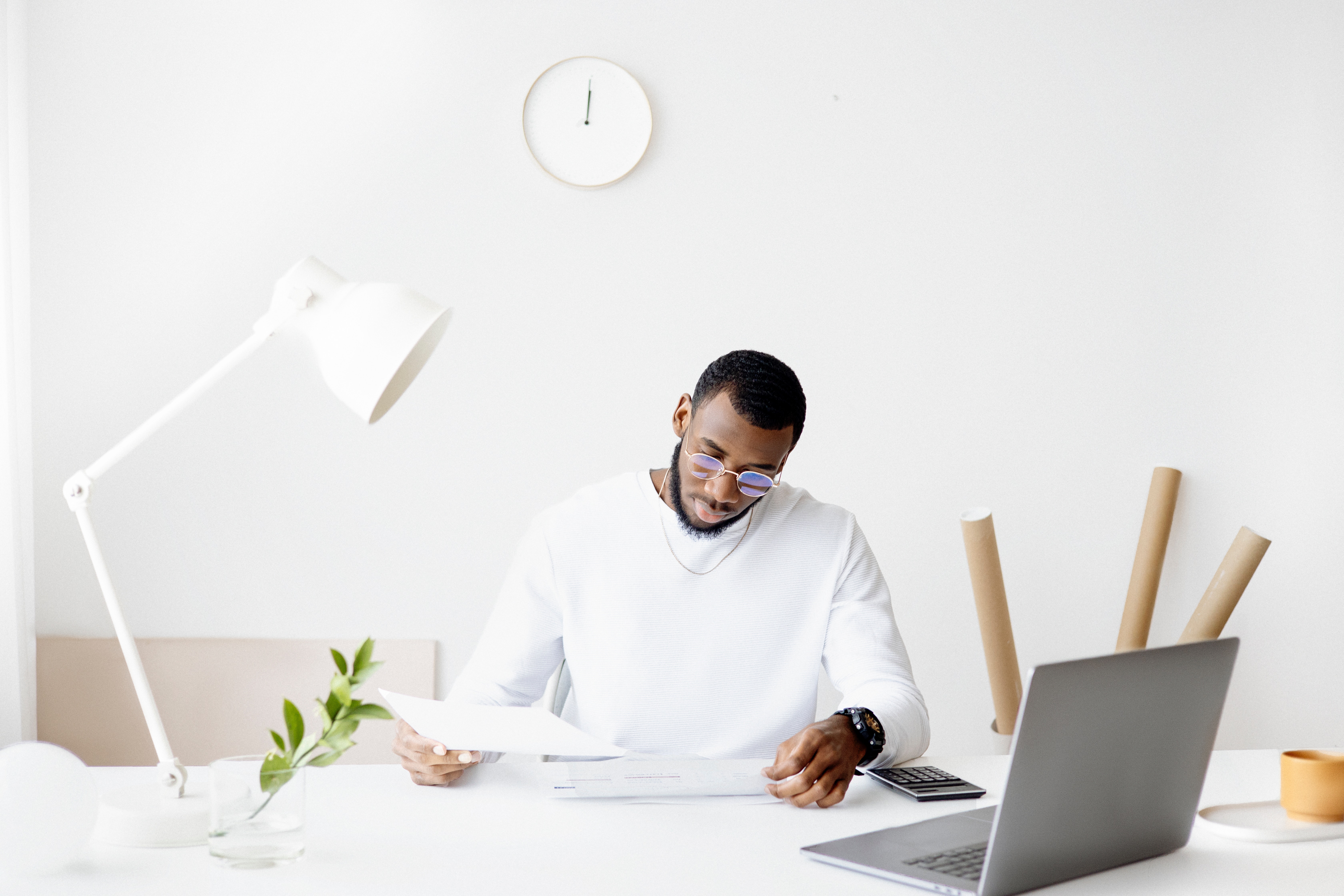 Man sitting at table using computer