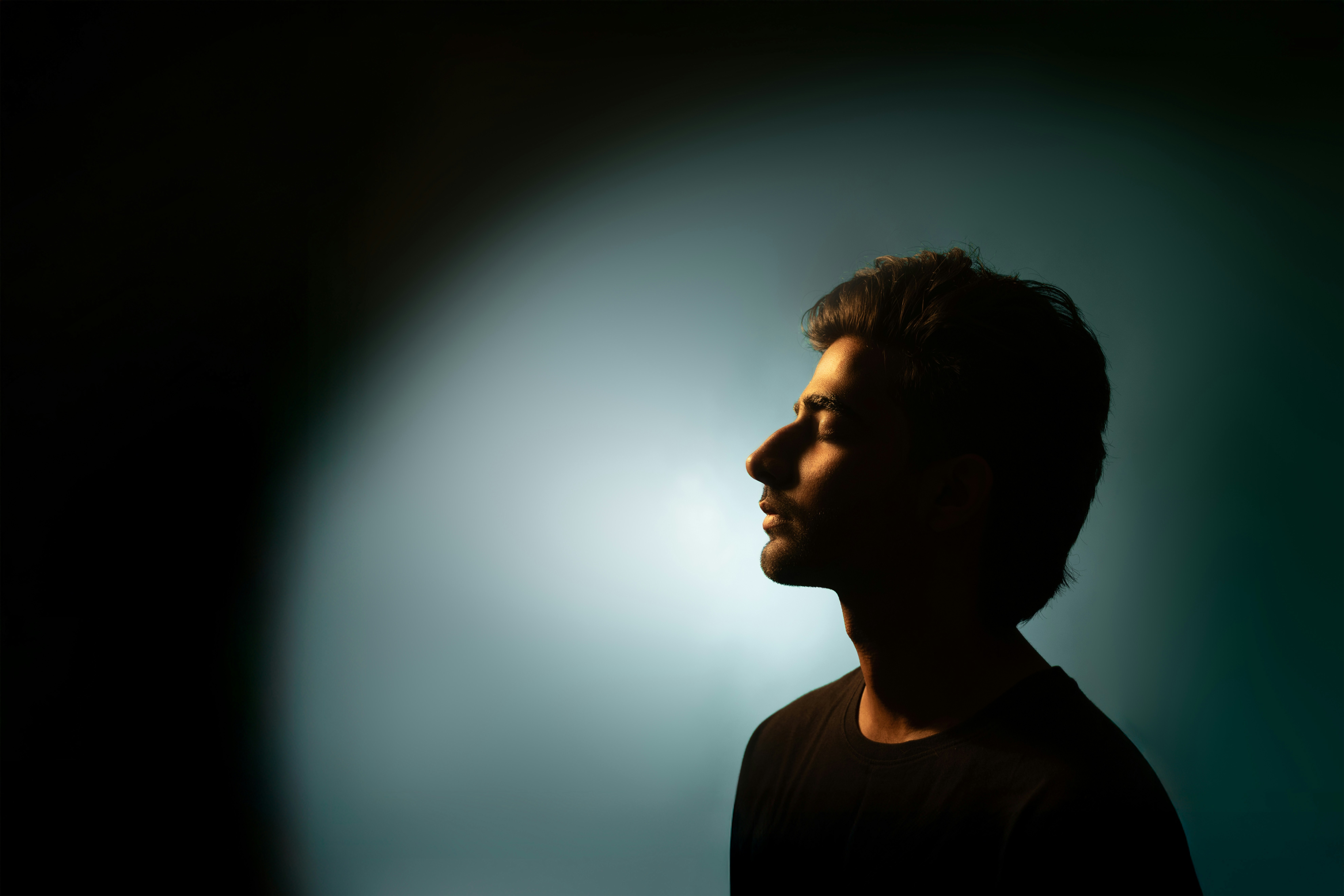 group of people sitting on green grass field during daytime