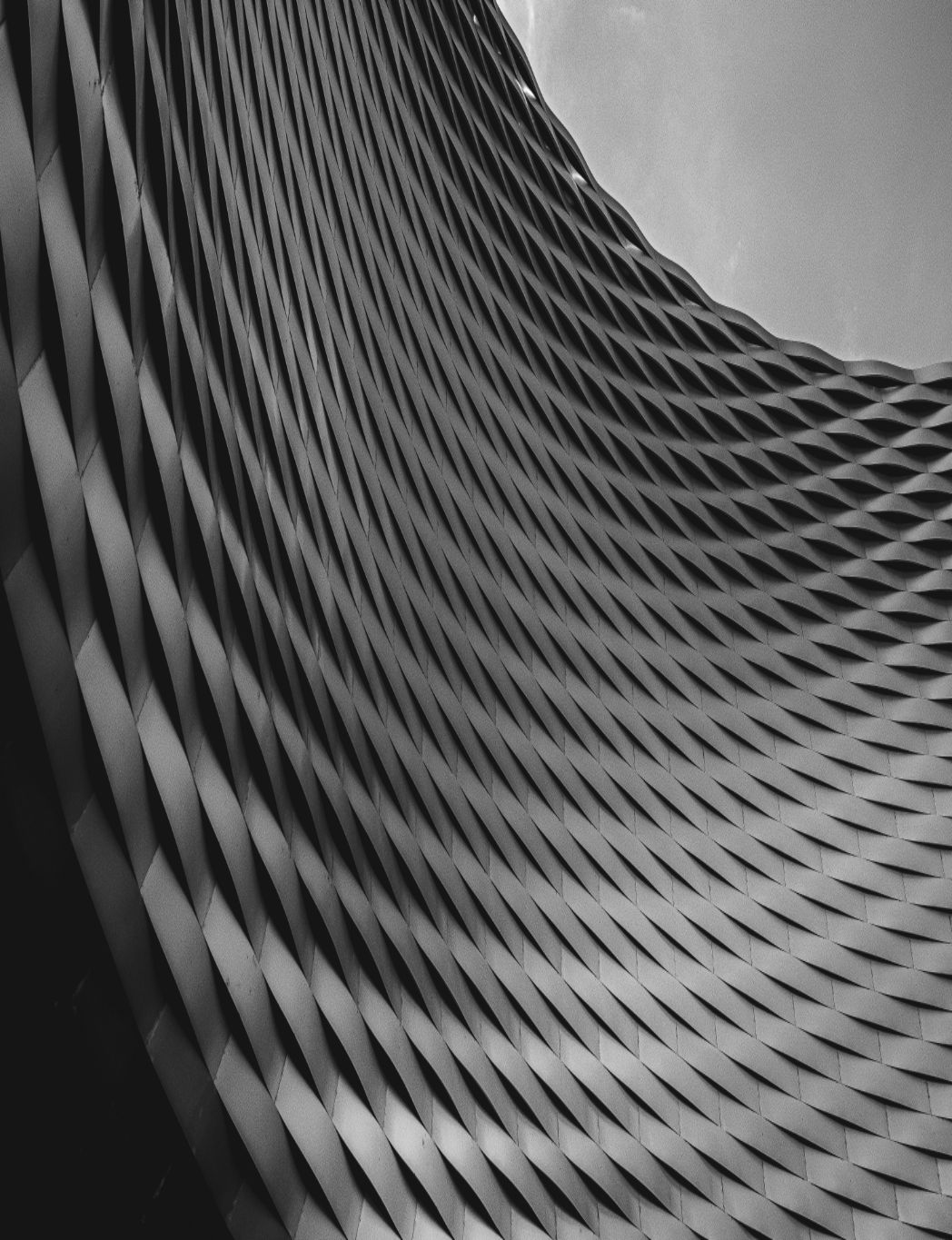 two people looking at a tablet and smiling