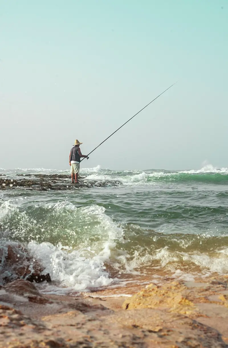 Fisherman fishing in the sea