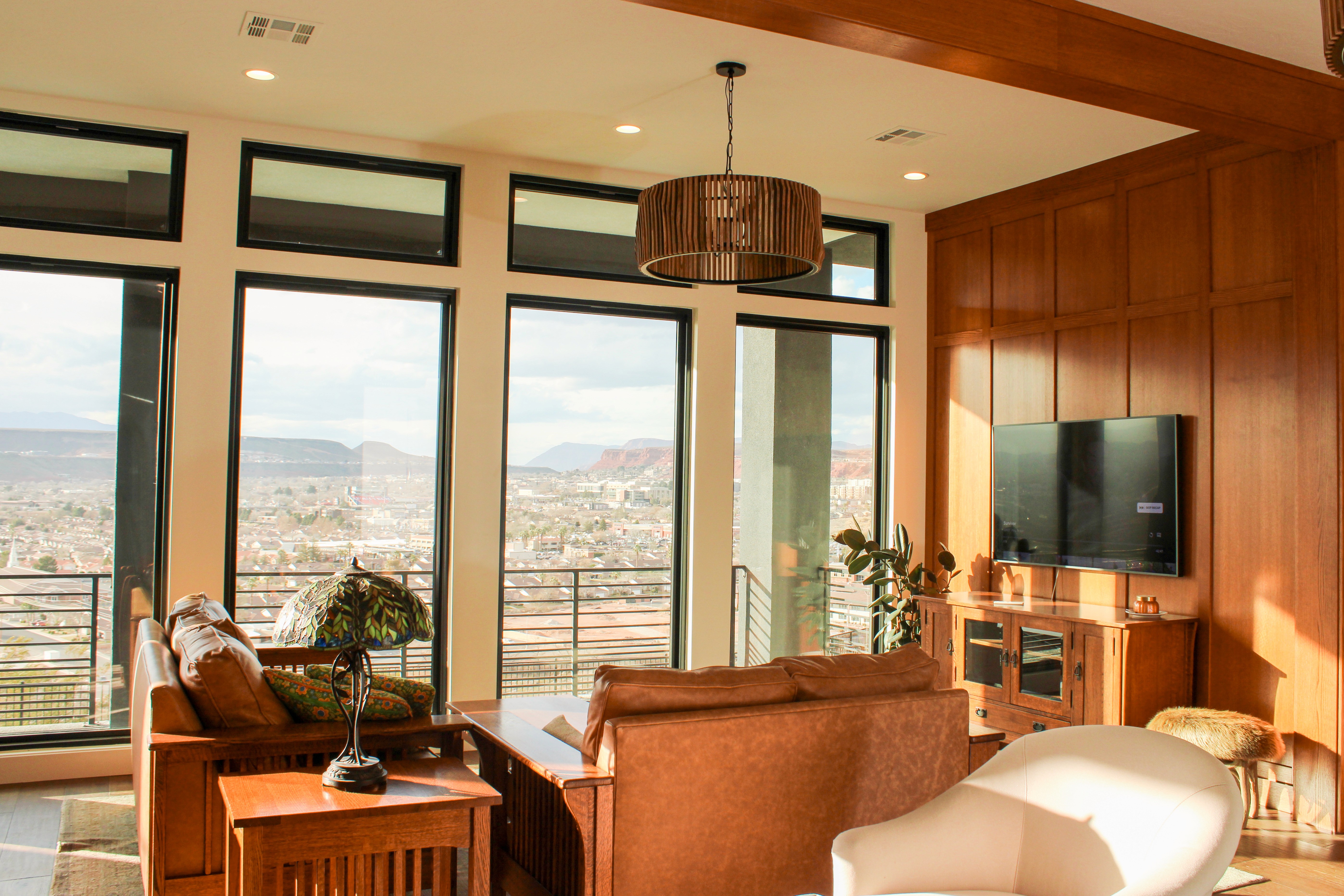 Retro-inspired living room with wood beams, accent wall, and detailed woodwork in a St. George, Utah remodel by Madsen Homes
