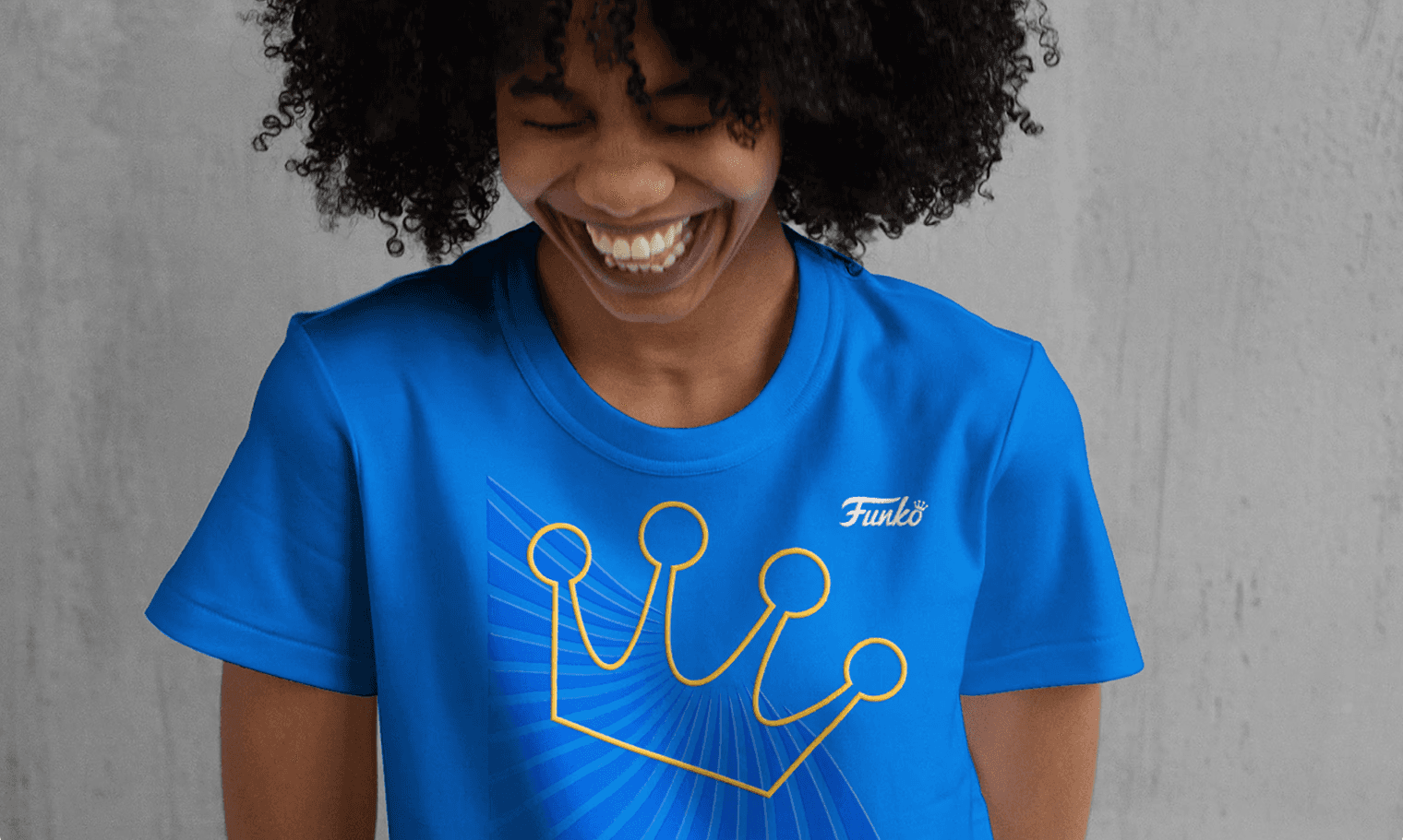 A person in a Funko t-shirt with a stylized funko crown