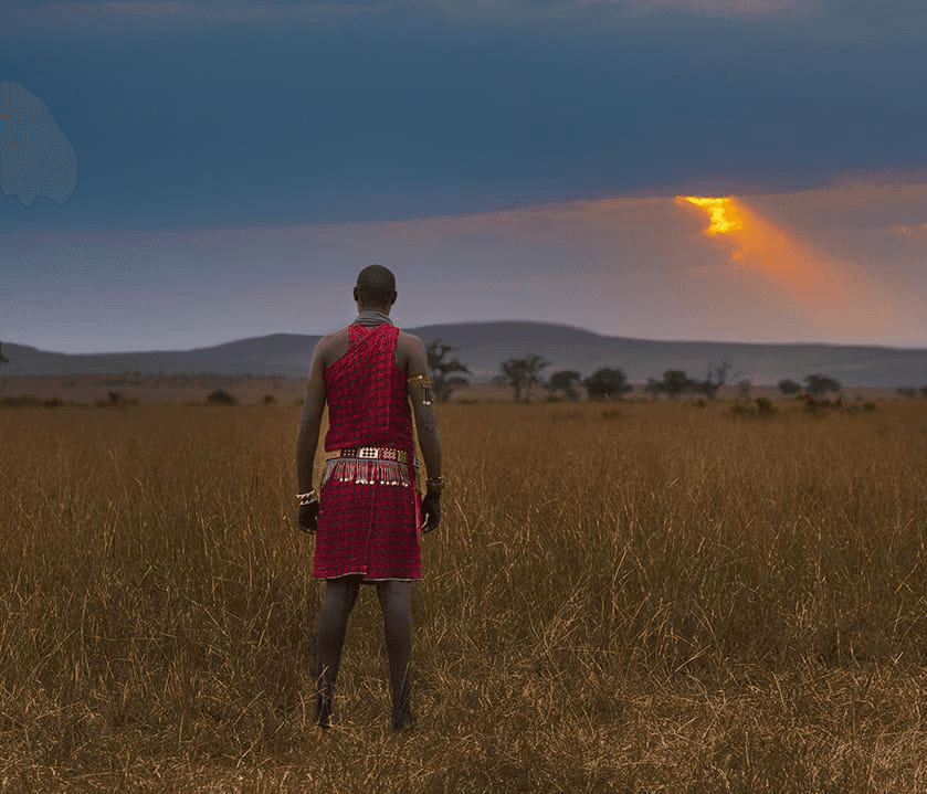 A Masai tribe member enjoying sunset in Masai Mara