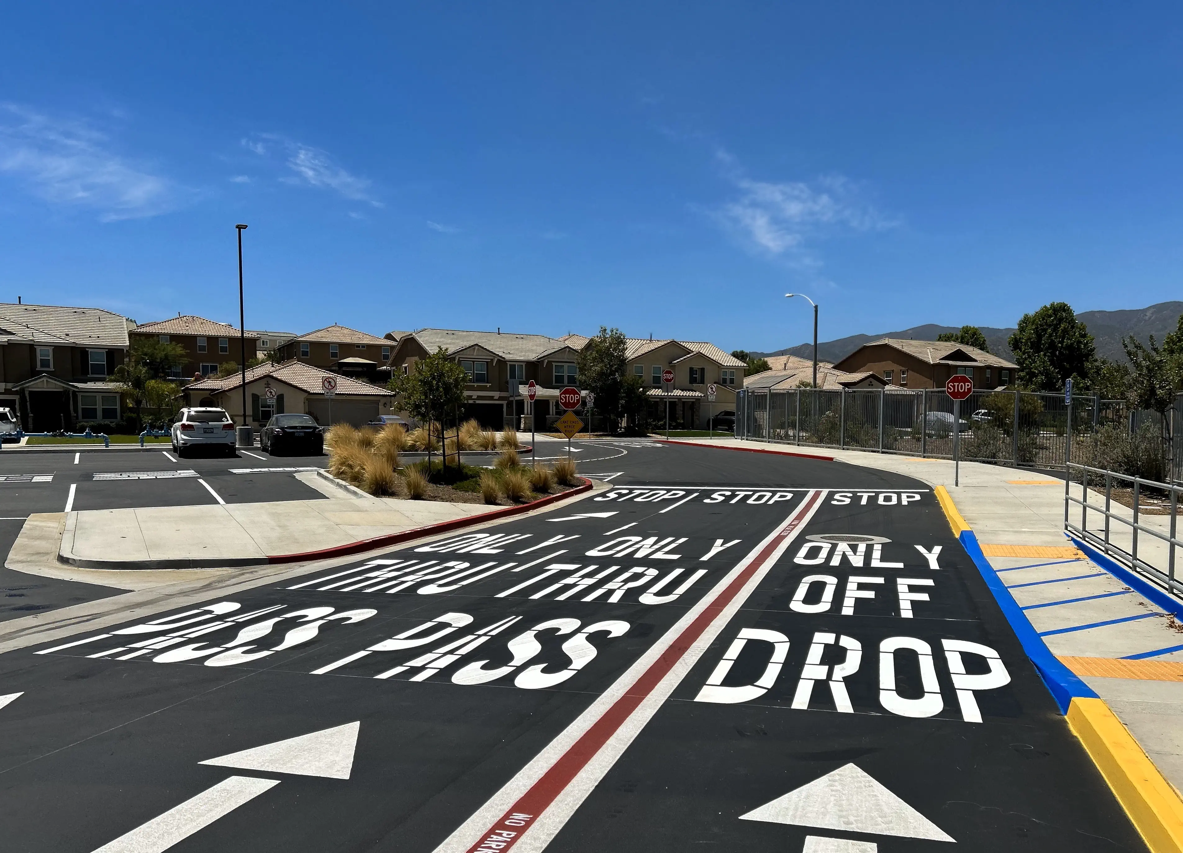 Brand new asphalt street with crisp stencils and arrows