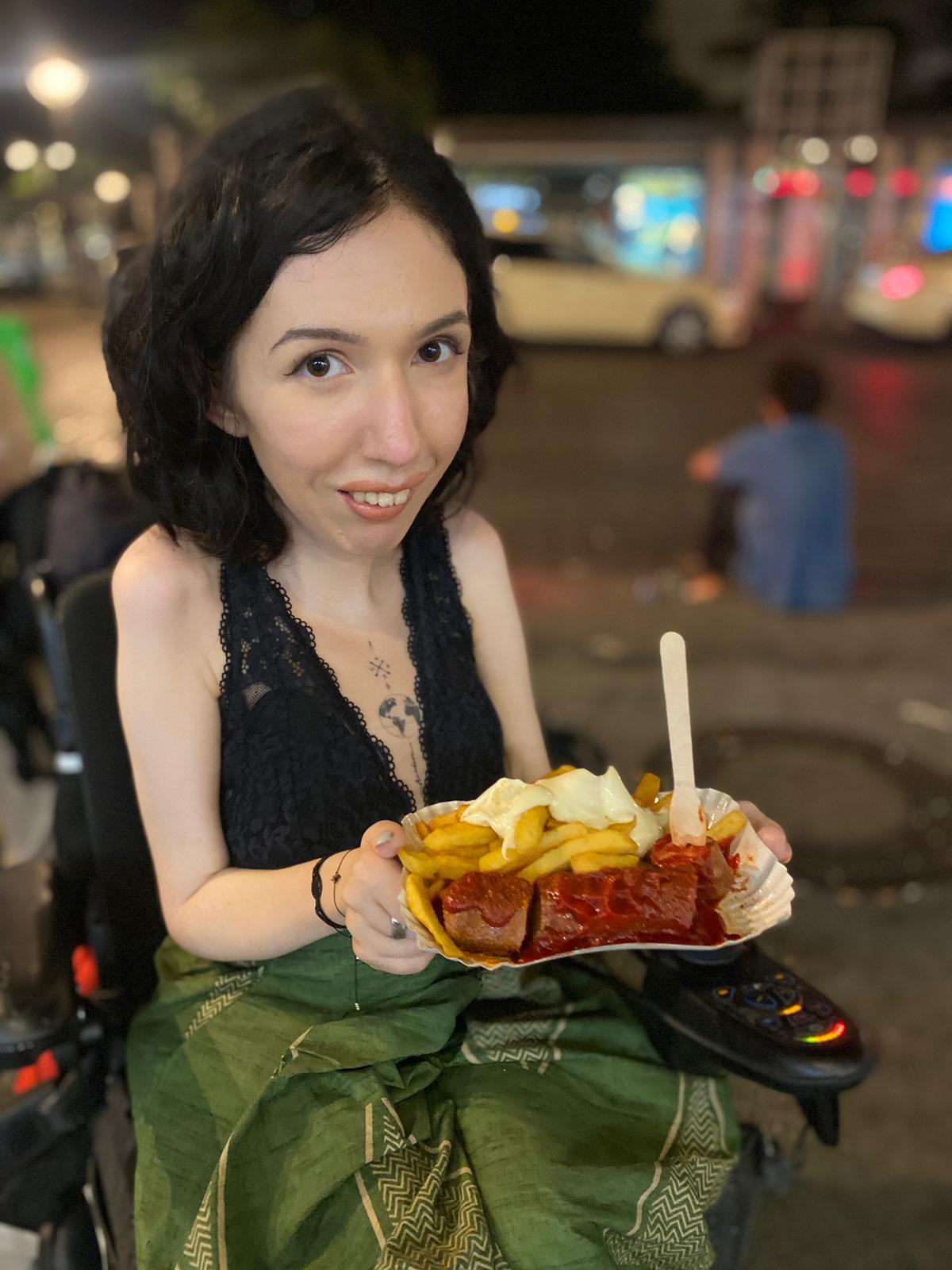yellow Labrador retriever biting yellow tulip flower