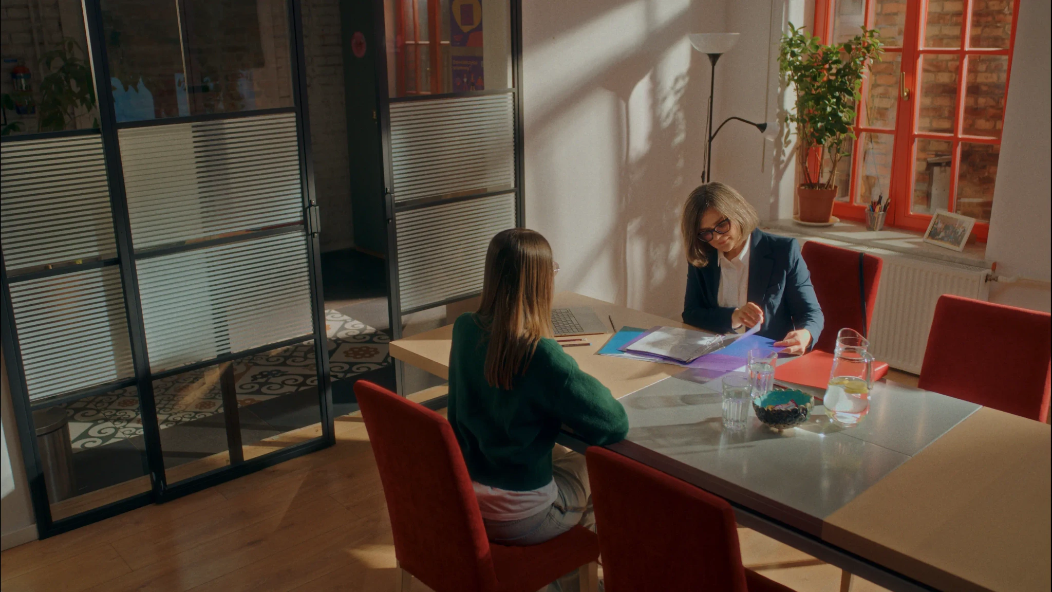 A man puts food in the microwave.