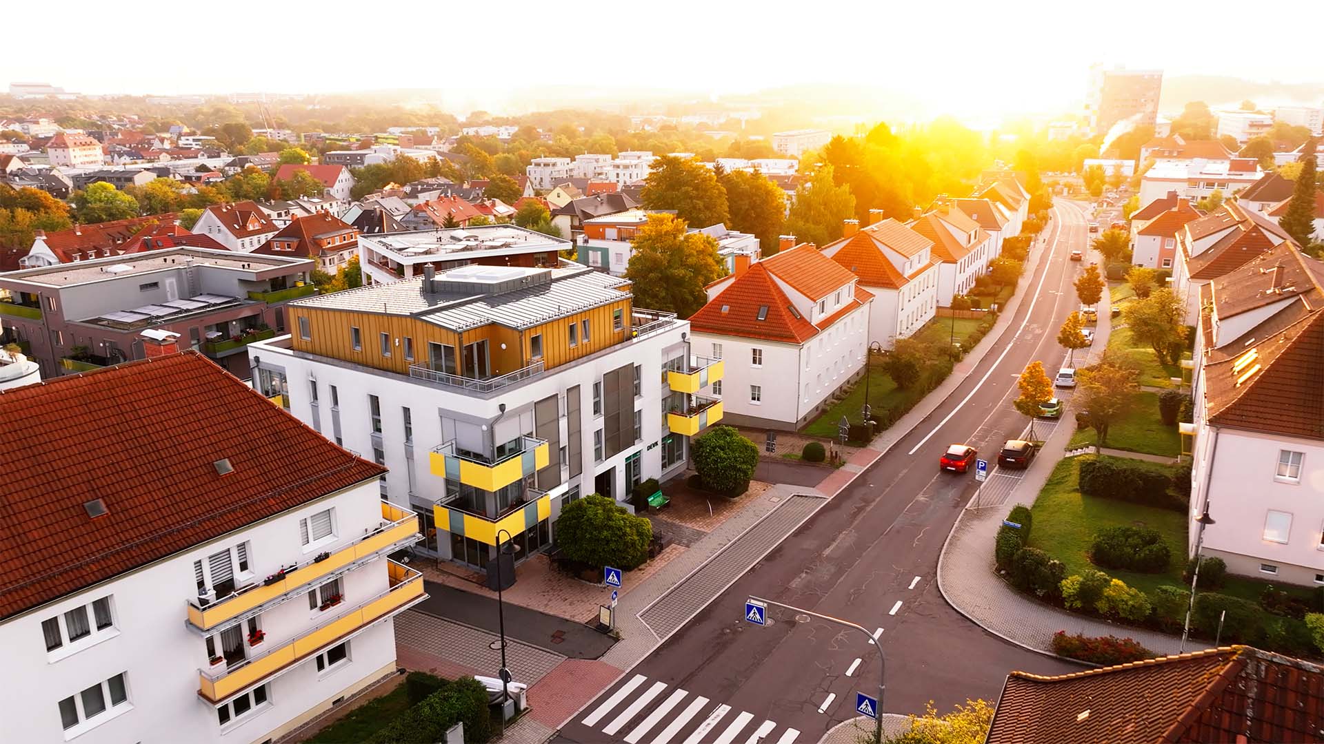 Aerial view of a sunset-lit neighborhood, ideal for strategic filmproduction, and social media campaign storytelling.