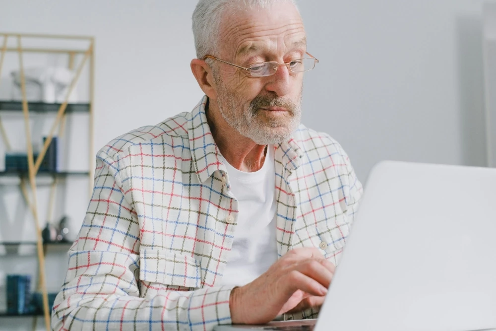 older man on computer