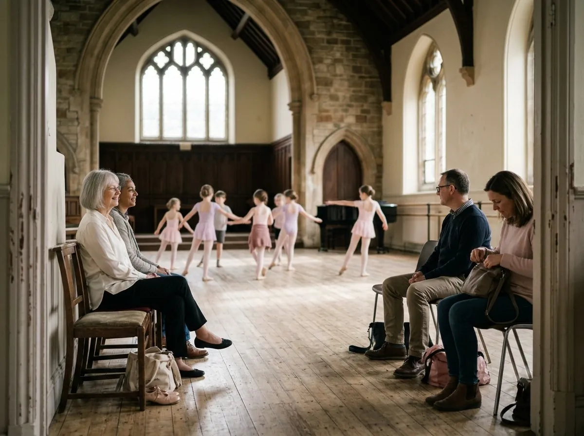 Parents watching a ballet class from chairs along the side of the studio