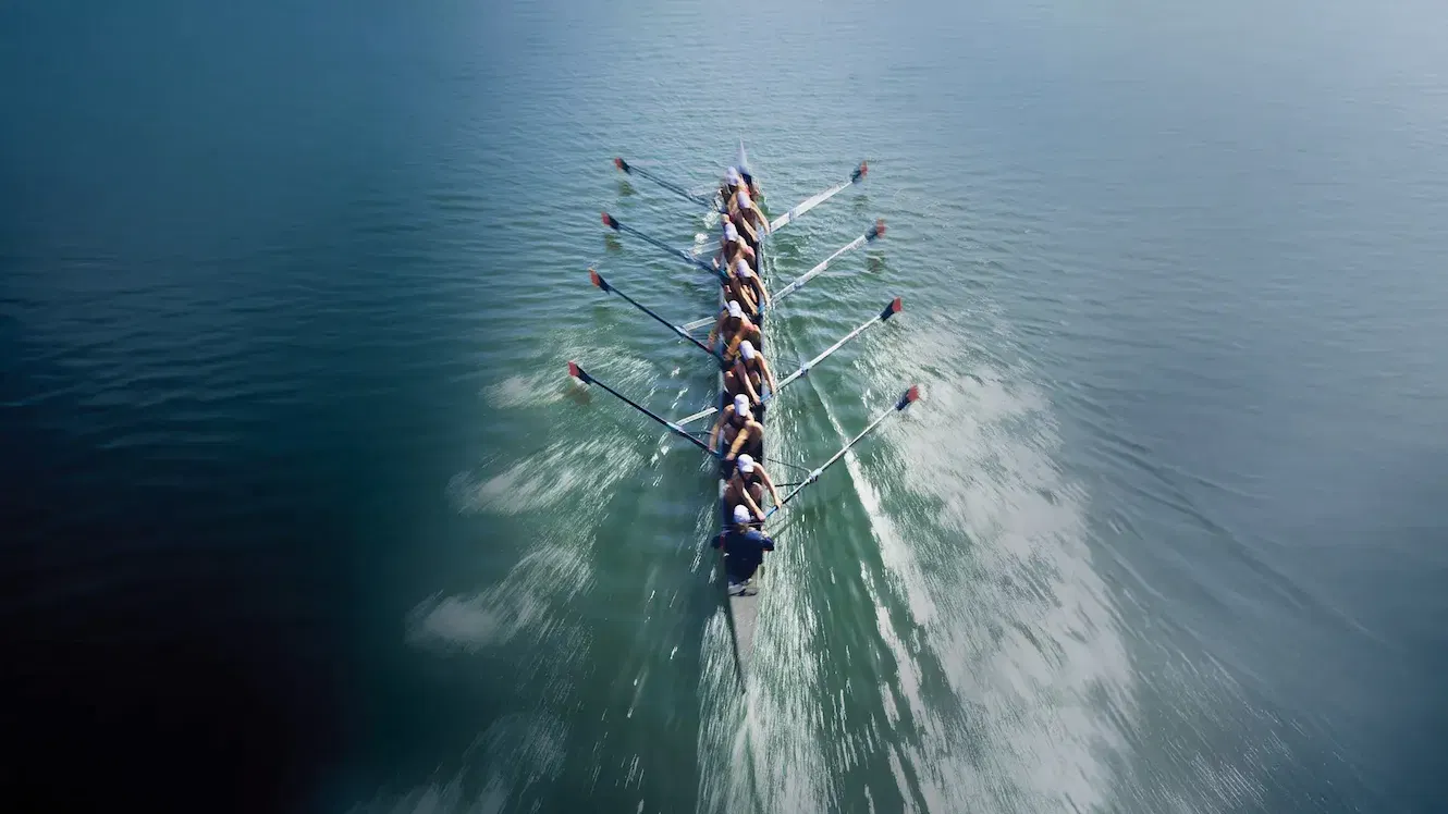 Sherpas guiding climbers up a mountain