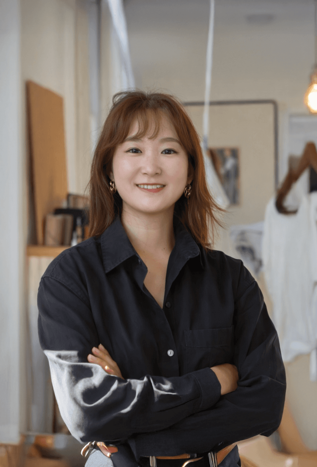 woman in black long sleeve shirt smoking cigarette