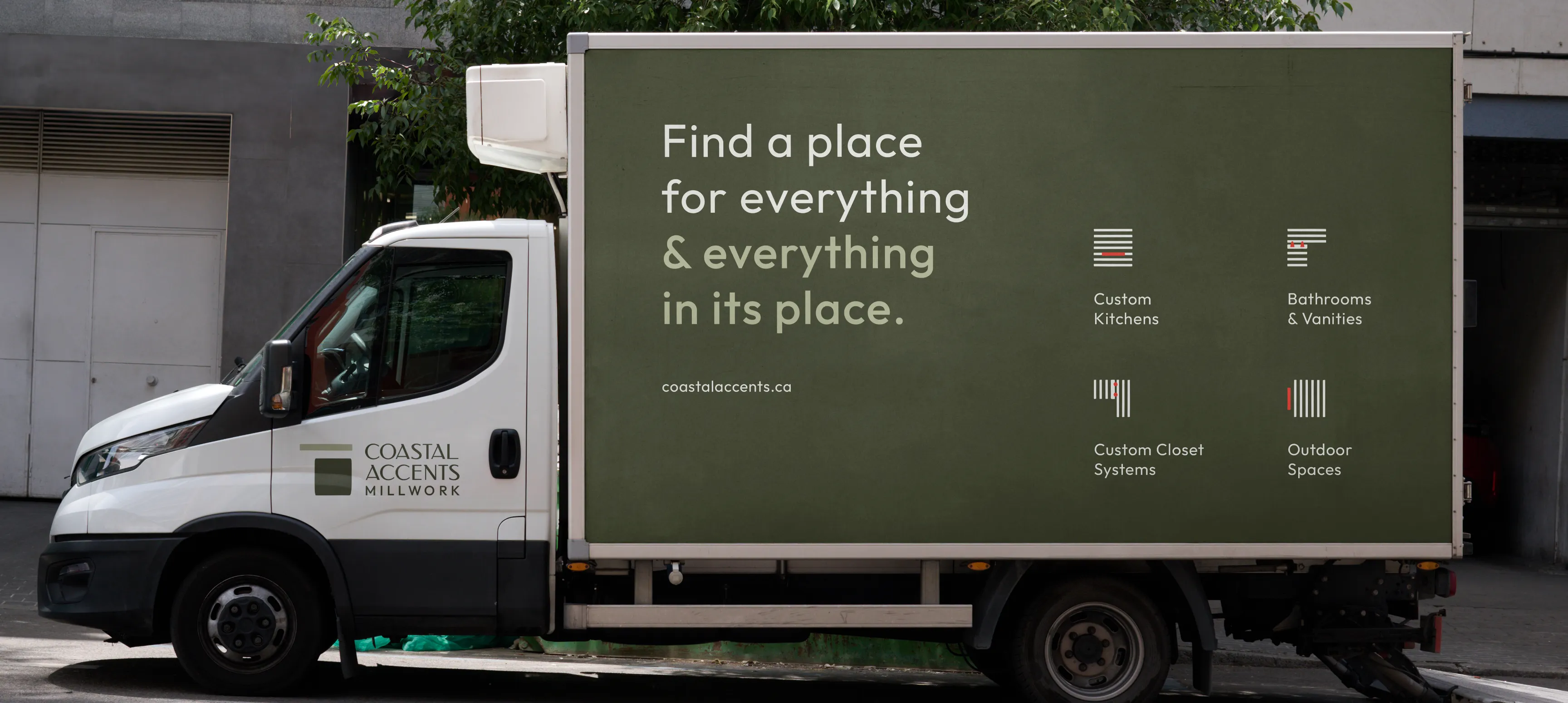 A Coastal Accents delivery truck that says "Find a place for everything and everything in its place."