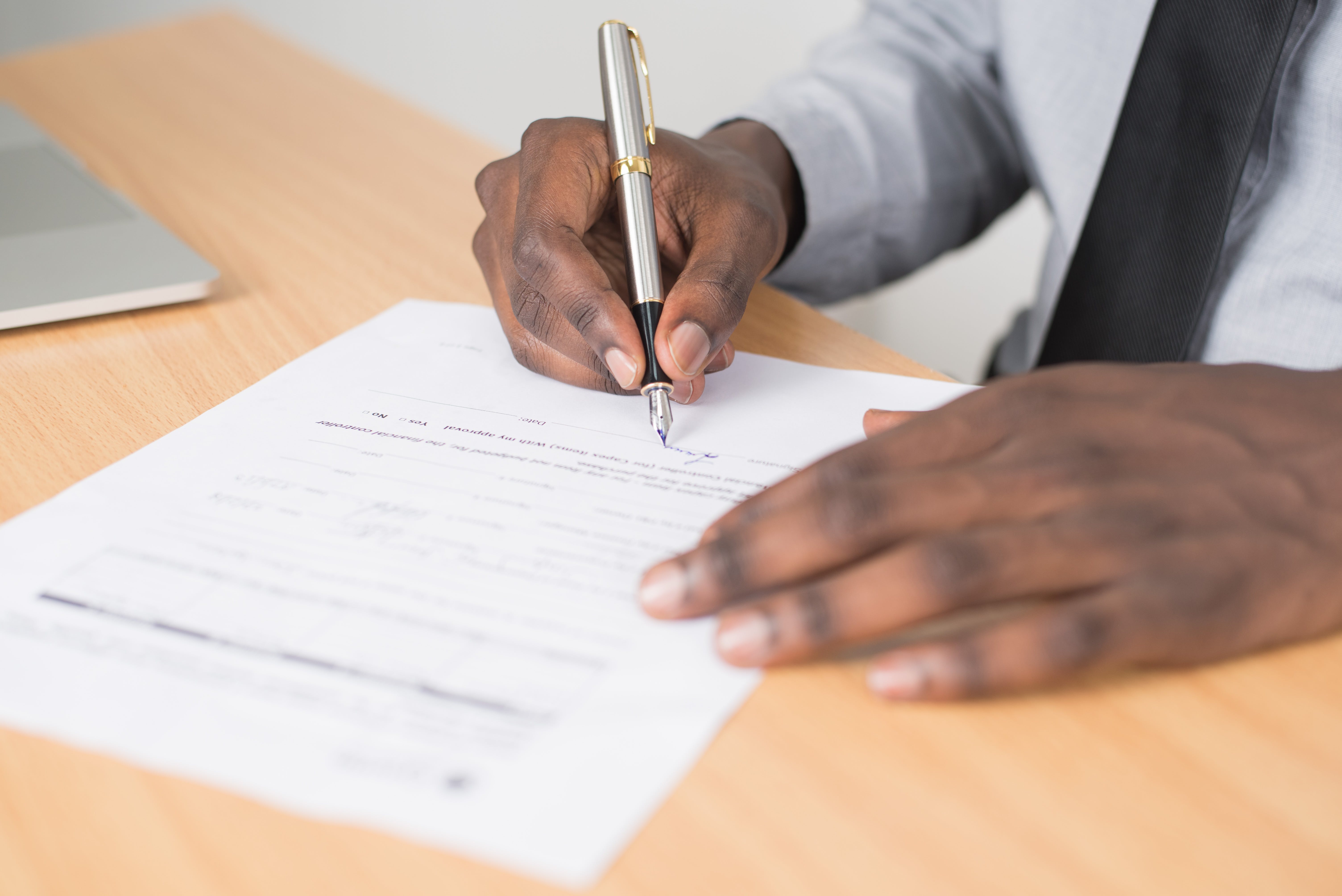 Man filling out mortgage application form