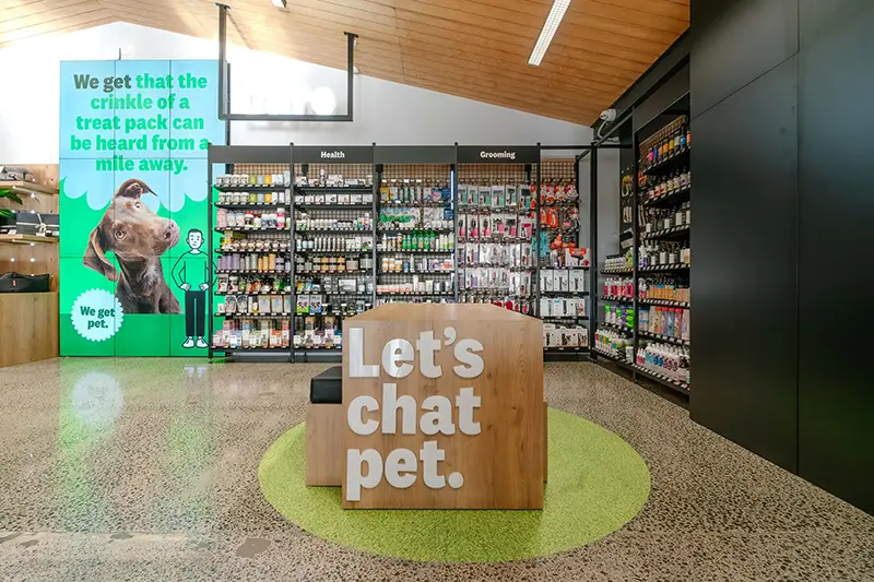 An interenal shot of the petdirect store showing a table whenre customers can talk to staff