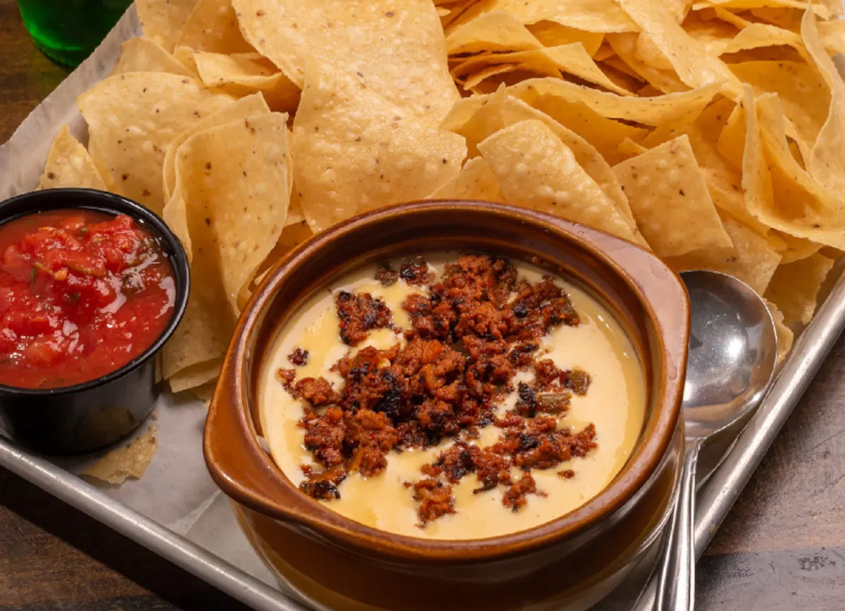 Chorizo queso dip with tortilla chips and salsa at Matt and Tony's