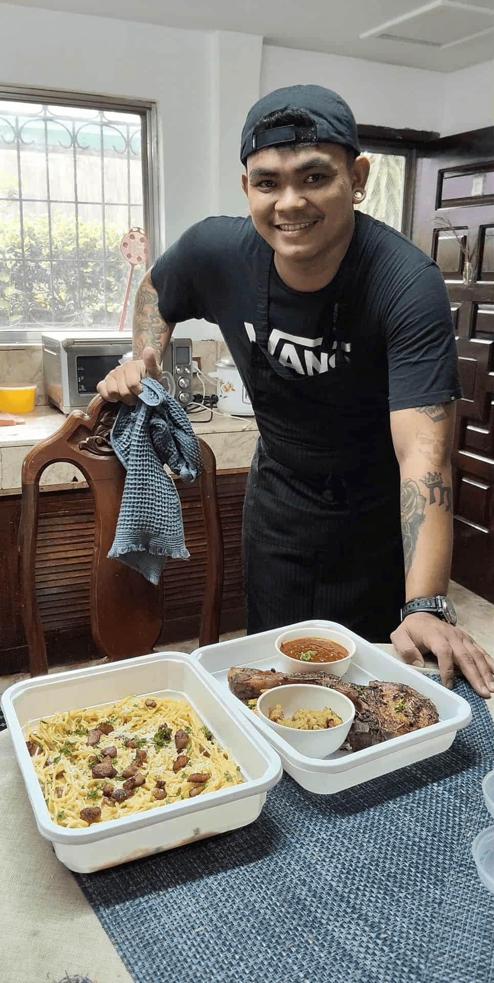 man in green crew neck shirt and black hat