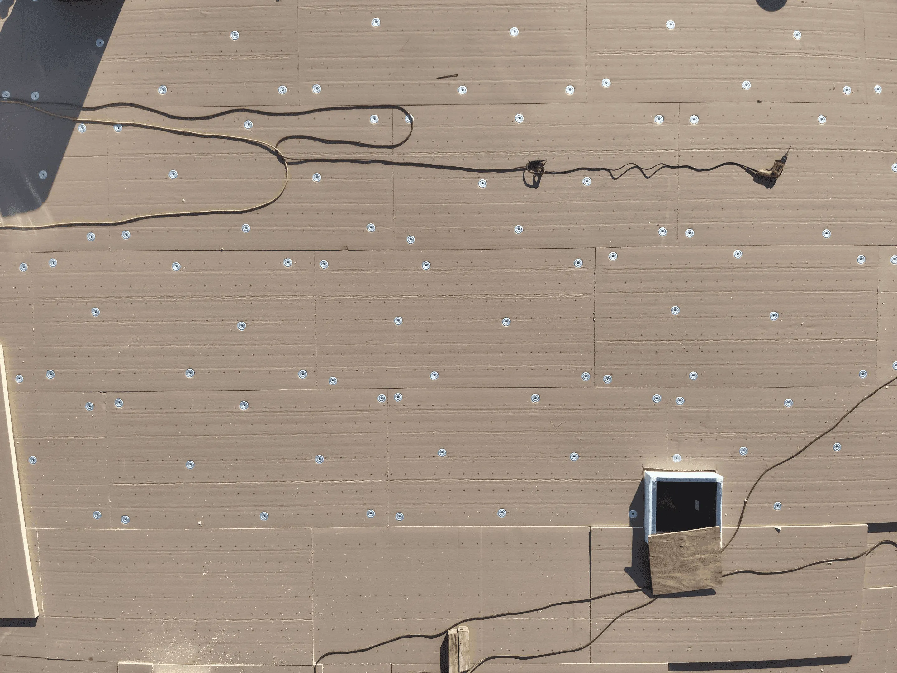 work in progress of a tpo roof replacement project in dallas texas by arrington roofing