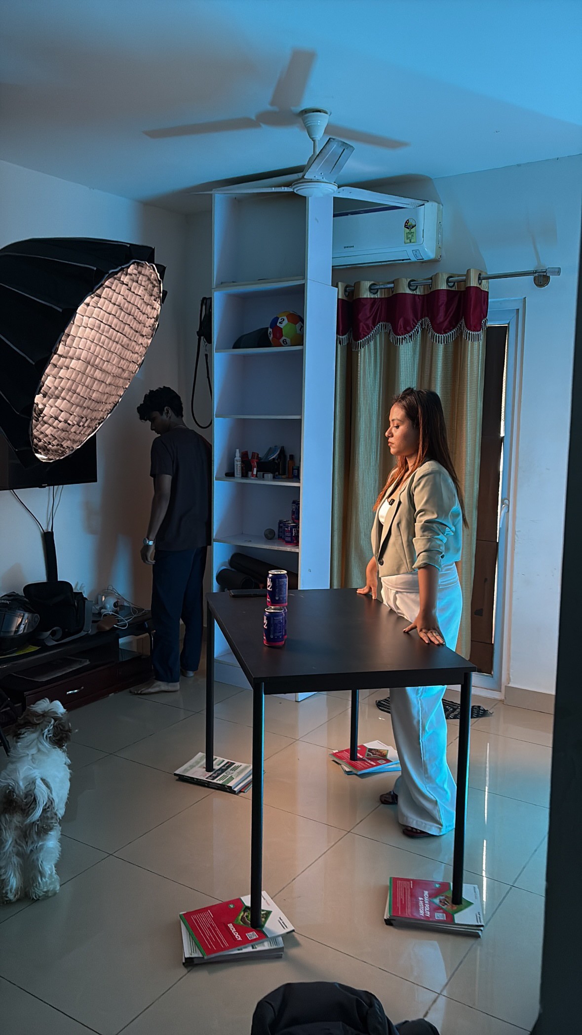 Woman in a beige turtleneck by an old computer and TV, retro 80s office portrait.