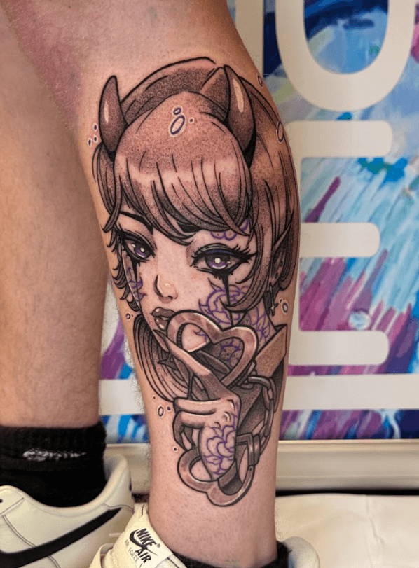 A vibrant tattoo of a chainsaw-like creature on a person's forearm. The tattoo is detailed with shades of orange, black, teal, and red.