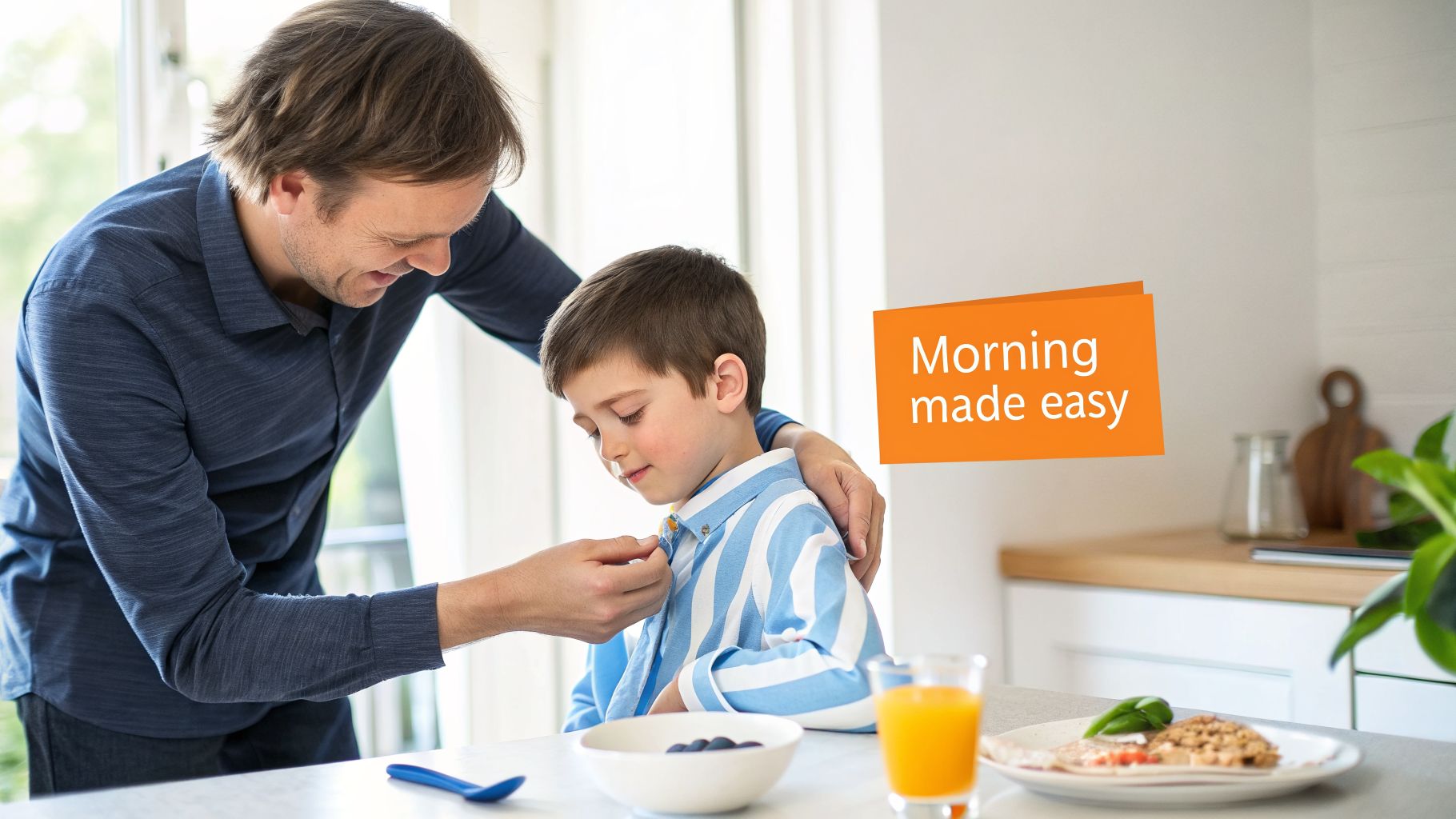 A smiling father helps his young son button his shirt at a bright breakfast table, making the morning easier.