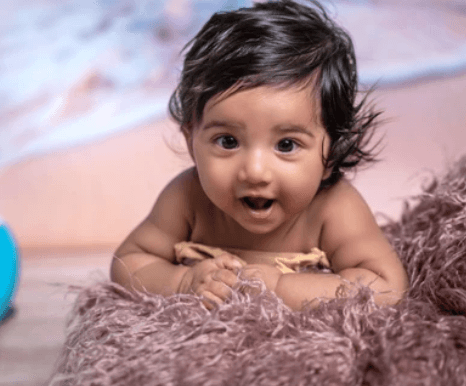 Snowy mountain landscape at sunset with dramatic clouds