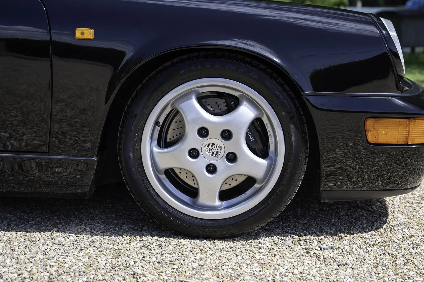 Close-up of the magnesium Cup wheel and cross-drilled brake disc