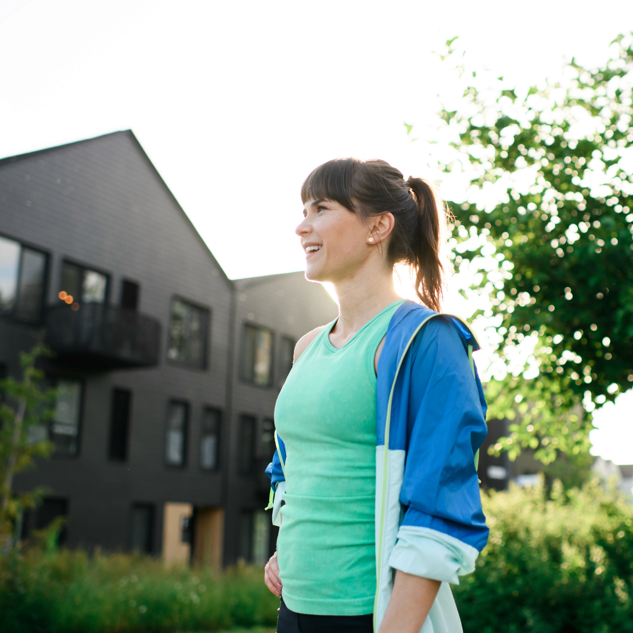 Advertising photography of woman preparing to jog outside Ninebark Apartments Camas Washougal WA