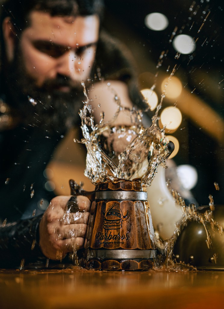 A man stading with Surfboard