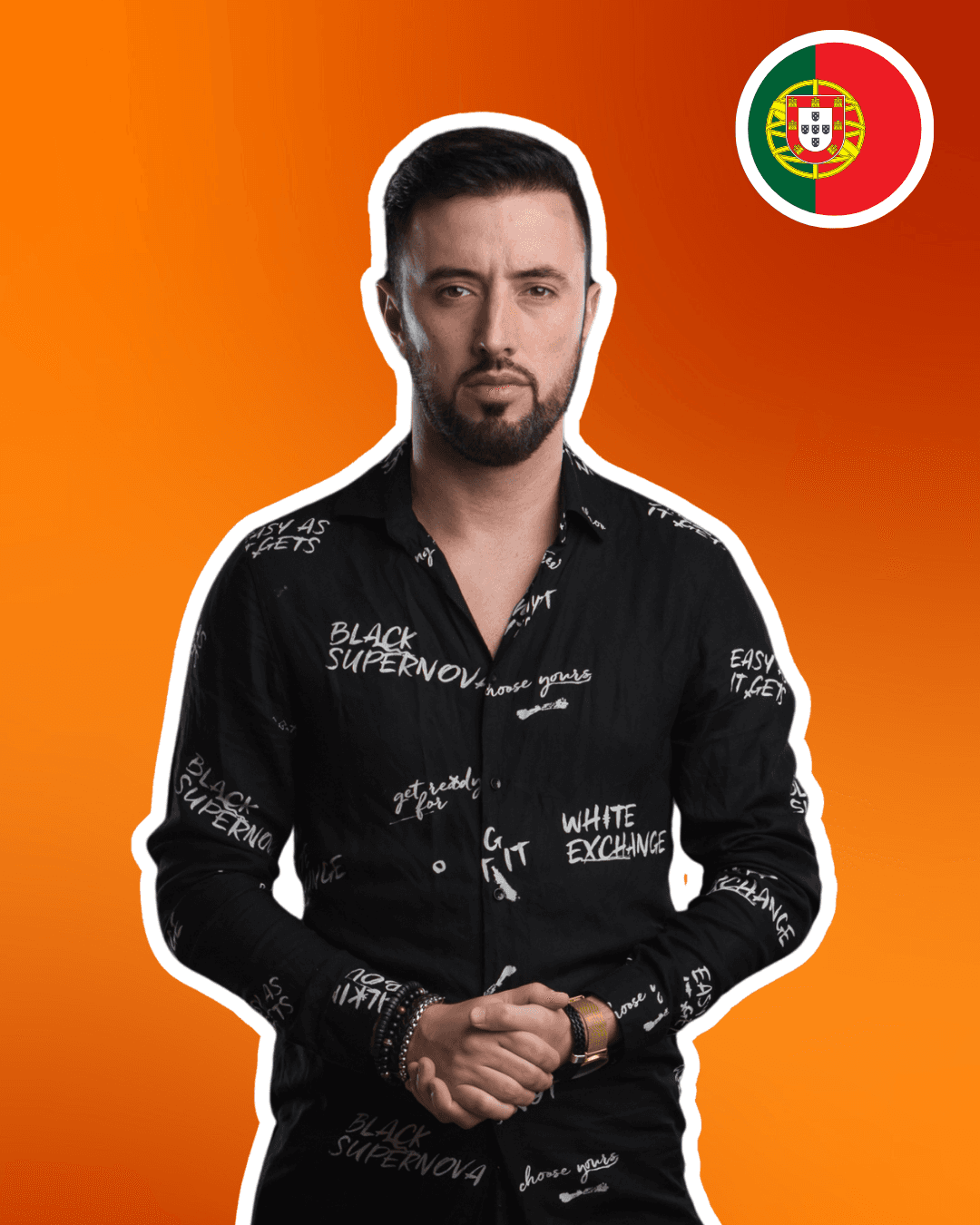 Smiling young man with curly hair, wearing a dark hoodie, against a softly lit background.