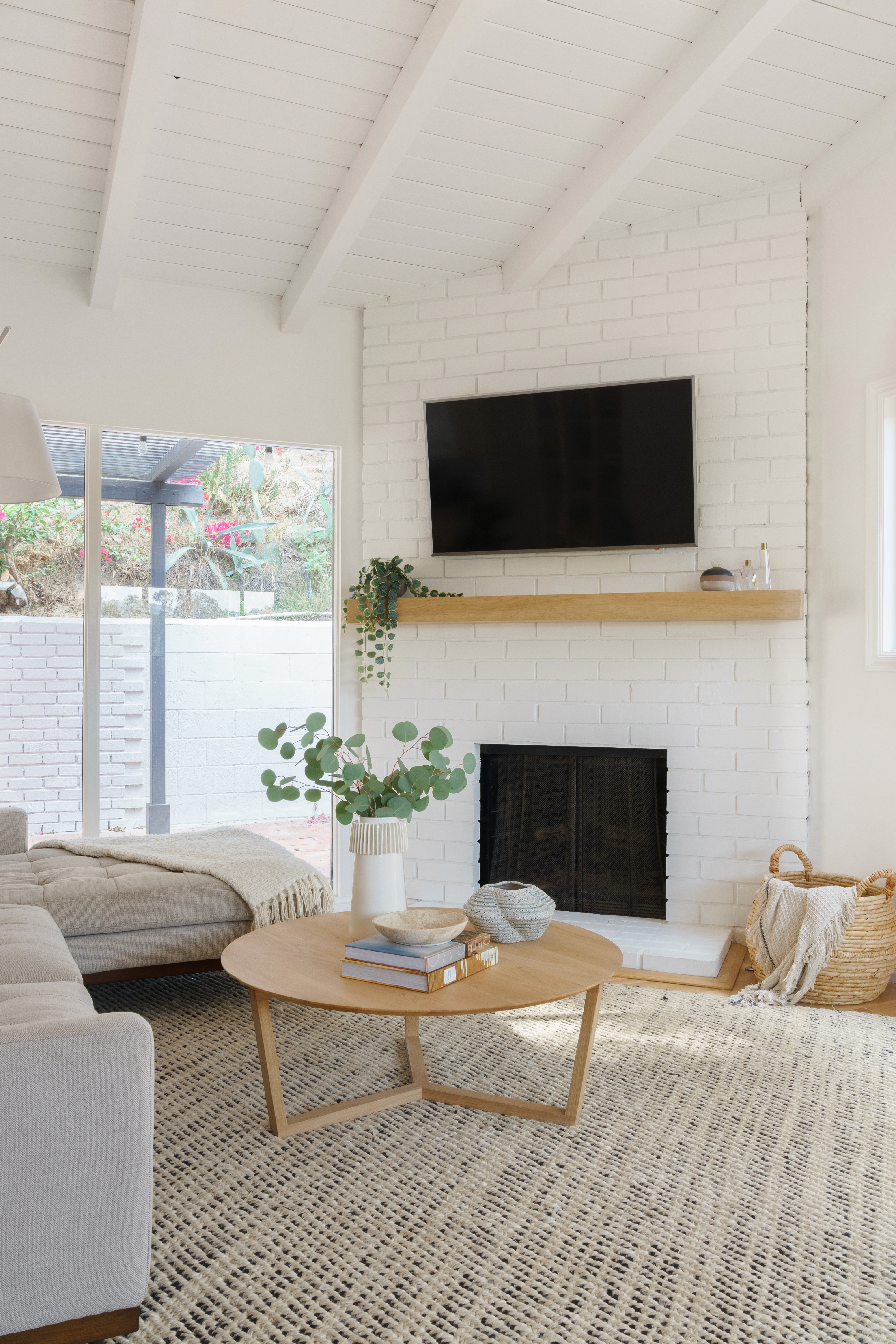 Mid-century living room refresh with a blend of classic design and contemporary comfort  by Ventura & Los Angeles interior designer Jubilee Interiors