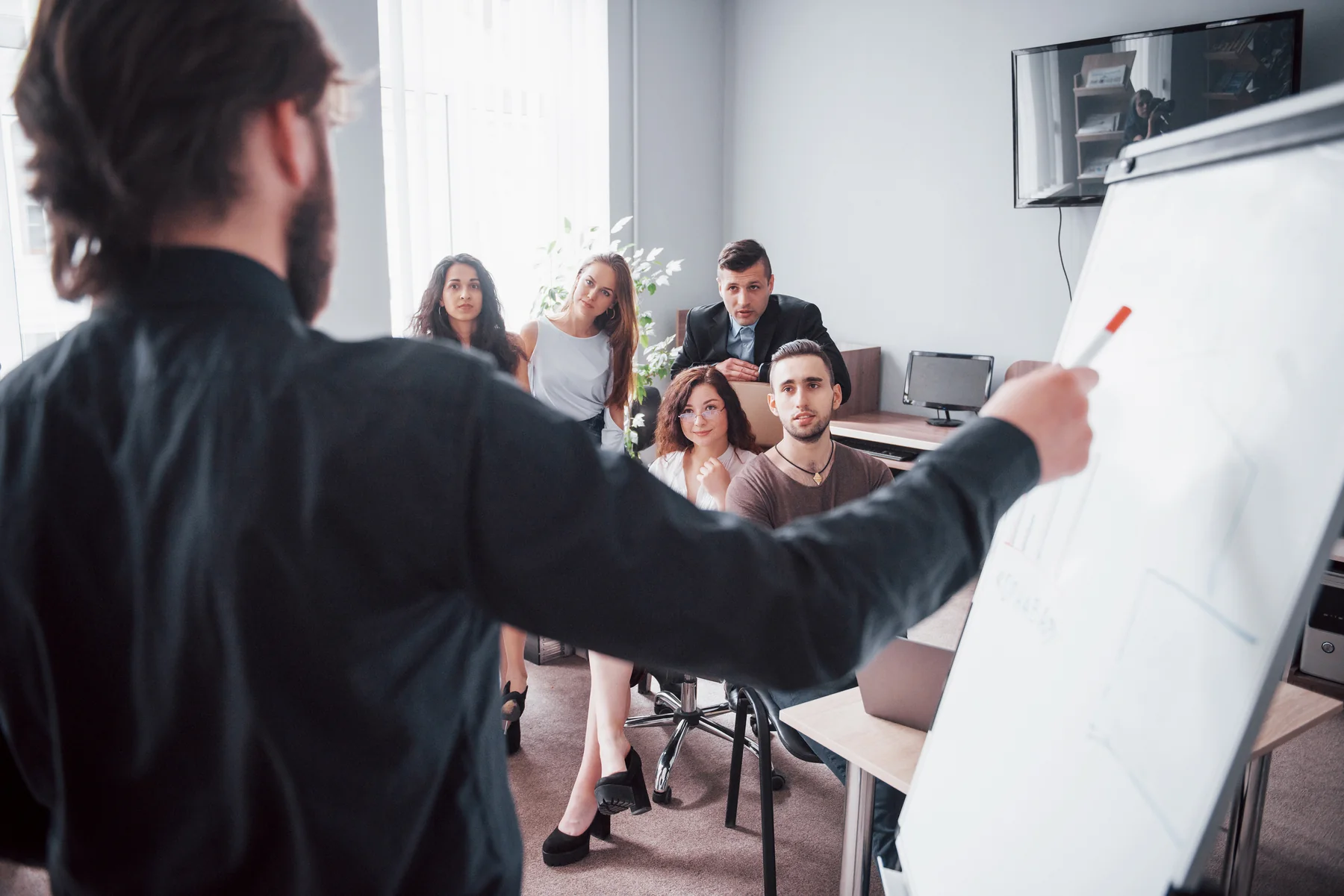 Team Brainstorming Meeting in a Bright Modern Office