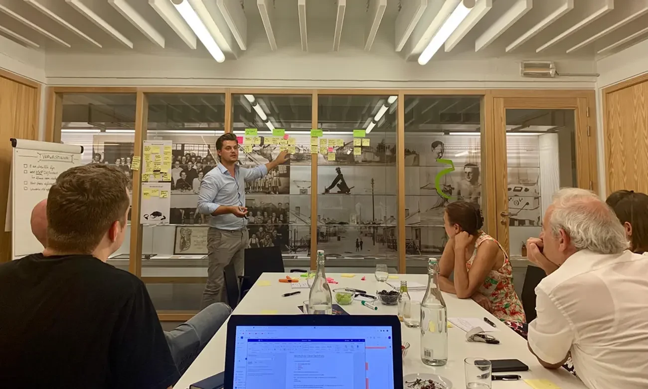 man presenting in ux workshop setting